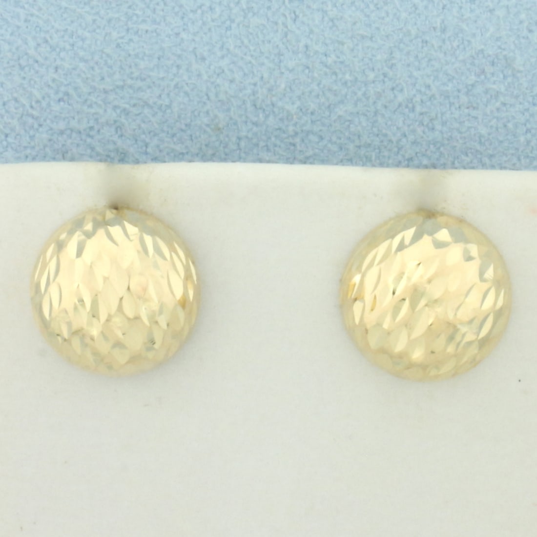 Diamond Cut Half-Dome Button Earrings in 14k Yellow Gold: In 14k Yellow Gold. 1/2 inch diameter. Friction backs. 2.1g.