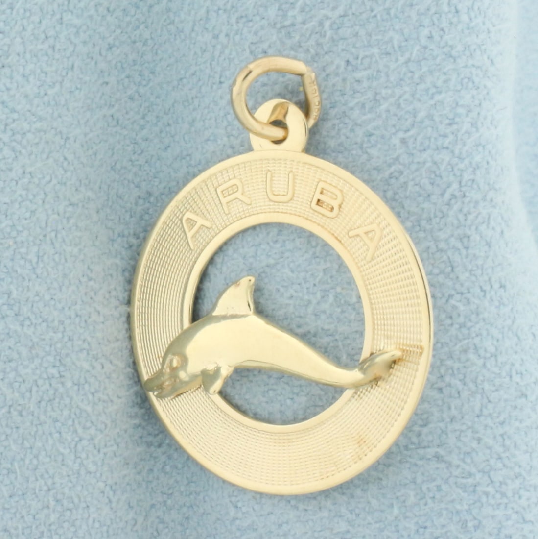 Aruba Dolphin Charm or Pendant in 14k Yellow Gold: In 14k yellow gold. 1 inch long x 3/4 inches wide. 1.7g.