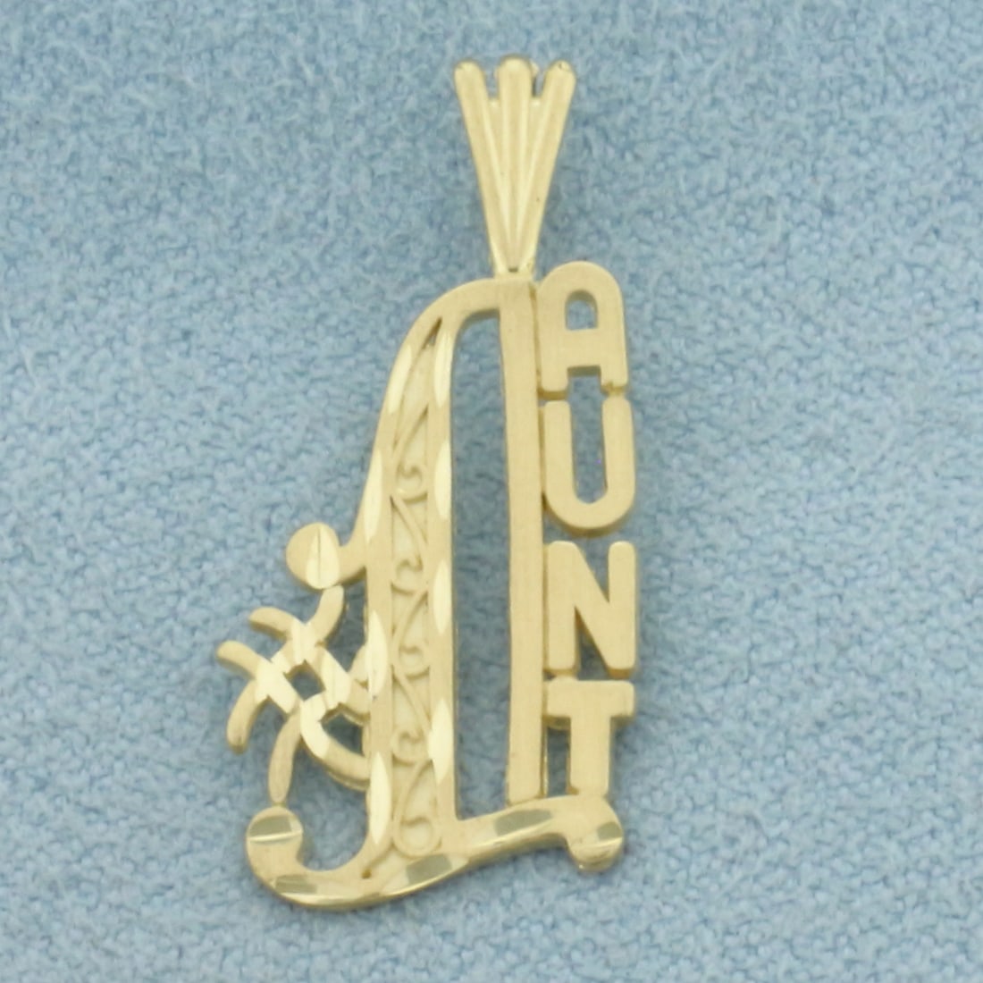 Diamond Cut #1 Aunt Pendant in 14k Yellow Gold: In 14k Yellow Gold. 1 inch long including bail. 1/2 inch wide. 1.1g.