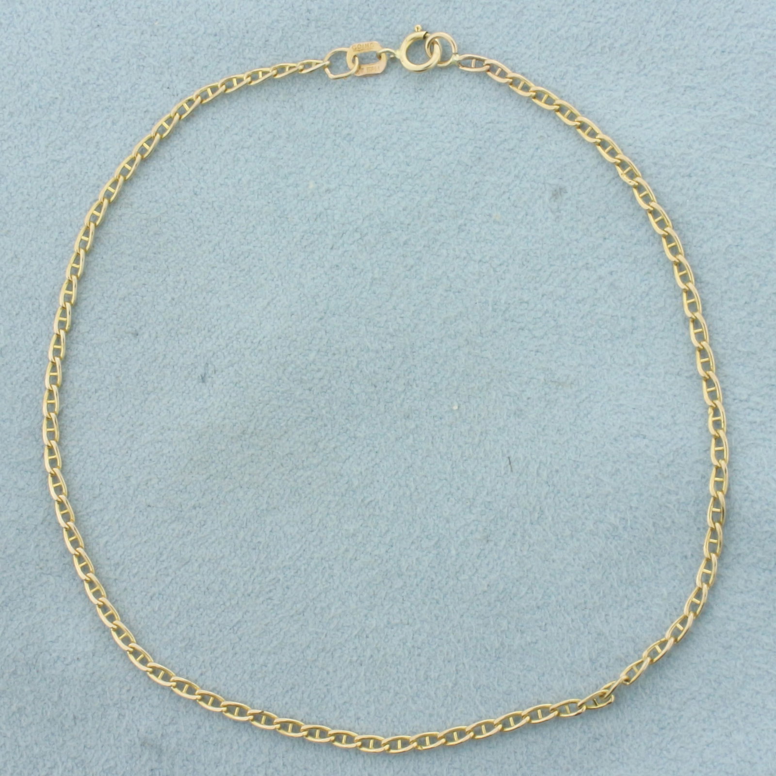 Anchor Mariner Link Bracelet in 14K Yellow Gold: In 14k yellow gold. 8 1/4 inches long by 1.7mm wide. Spring clasp. .8g.