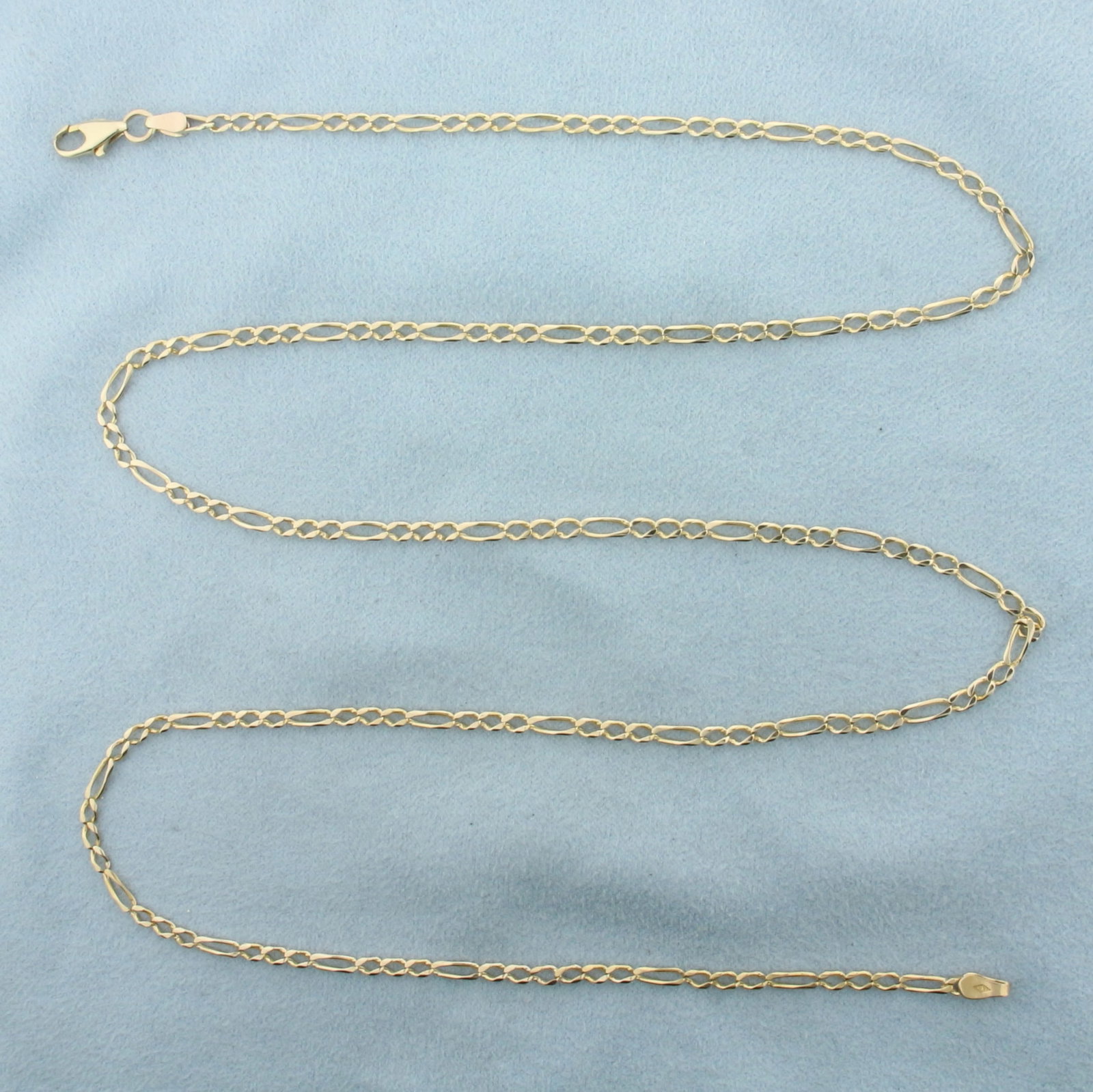 Italian Mens 26 Inch Figaro Link Chain Necklace in 14k Yellow Gold: In 14k Yellow Gold. 26 inches long. 2.5mm wide. Italian made. Lobster clasp. 7.4g.