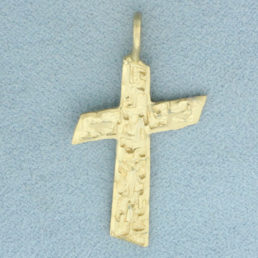 Diamond Cut Cross Pendant in 14k Yellow Gold: In 14k Yellow Gold. 1.5 inches long. 3/4 inch wide. 2.5g.