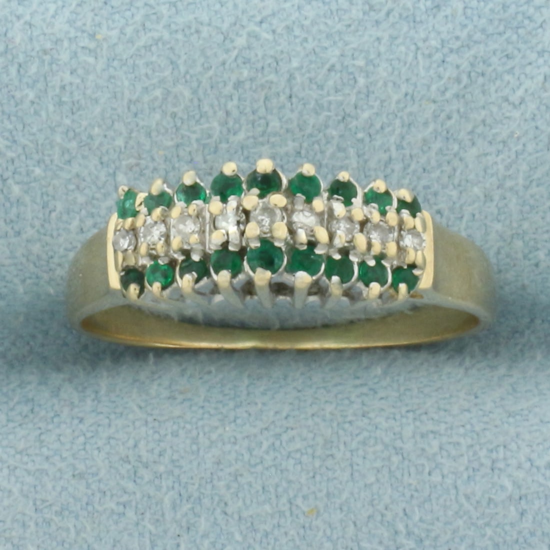 Emerald and Diamond Ring in 10k Yellow Gold: In 10k Yellow Gold. Contains eighteen 1.8mm high quality natural Emerald gemstones with intense color. Also contains nine high quality .01ct diamonds. 6mm wide at top of ring. Size 9. 3.0g.
