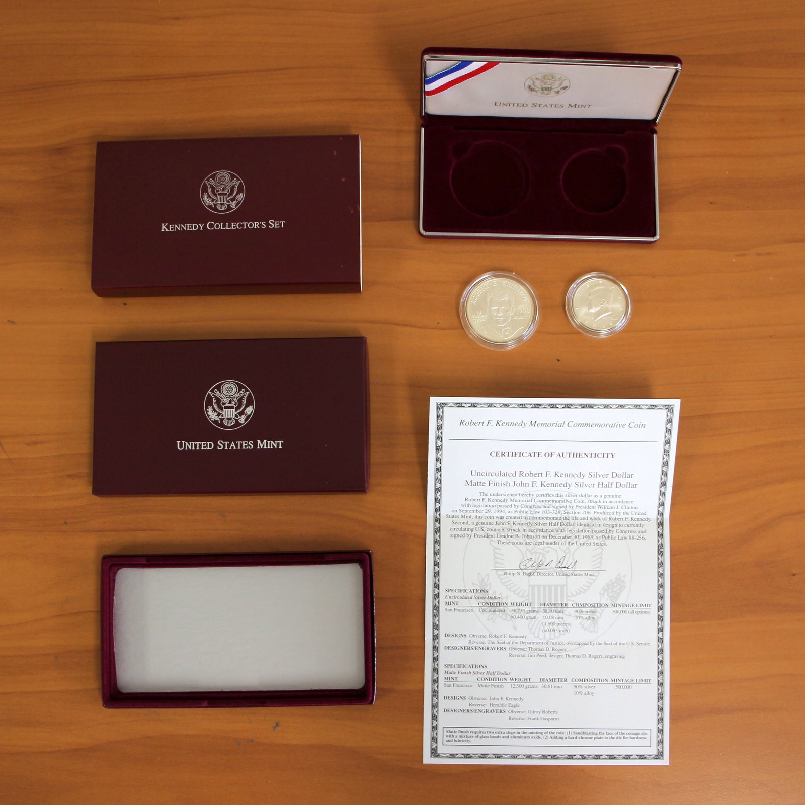 1998 US Mint Kennedy Collector's Silver Uncirculated Coin Set OGP: Contains one 90% Silver Kennedy Uncirculated Silver Dollar. Also contains one 90% Silver Matte Finish Kennedy Half Dollar. Includes CoA, original box and packaging.
