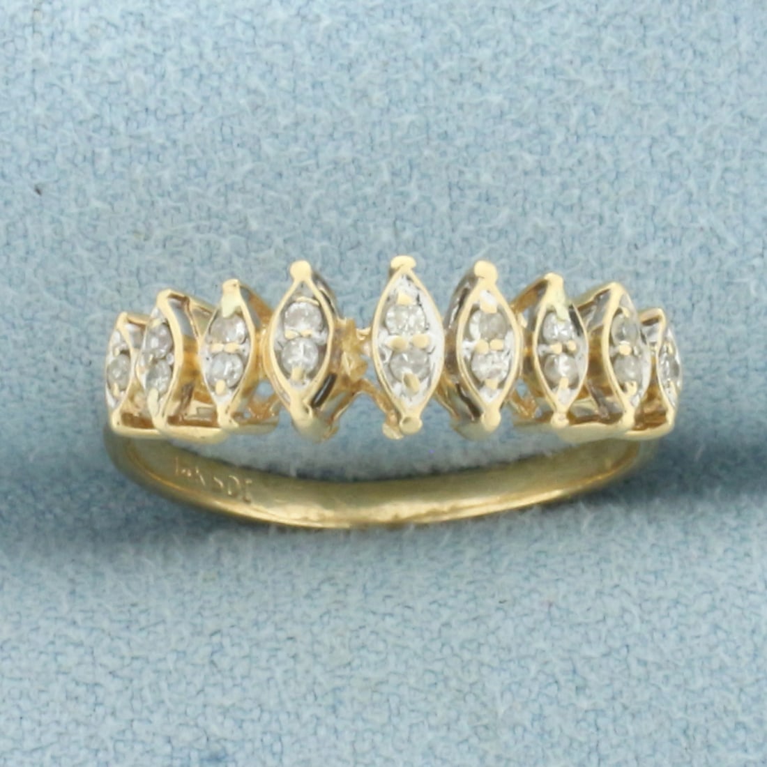 Vintage Diamond Wedding or Anniversary Ring in 14k Yellow Gold: In 14k Yellow Gold. Contains sixteen diamonds, 1/8ct TW, SI clarity/H color. Reflective white gold back of setting makes it look like 9 larger marquise diamonds. 6mm wide at widest point. Size 7. 2.2g