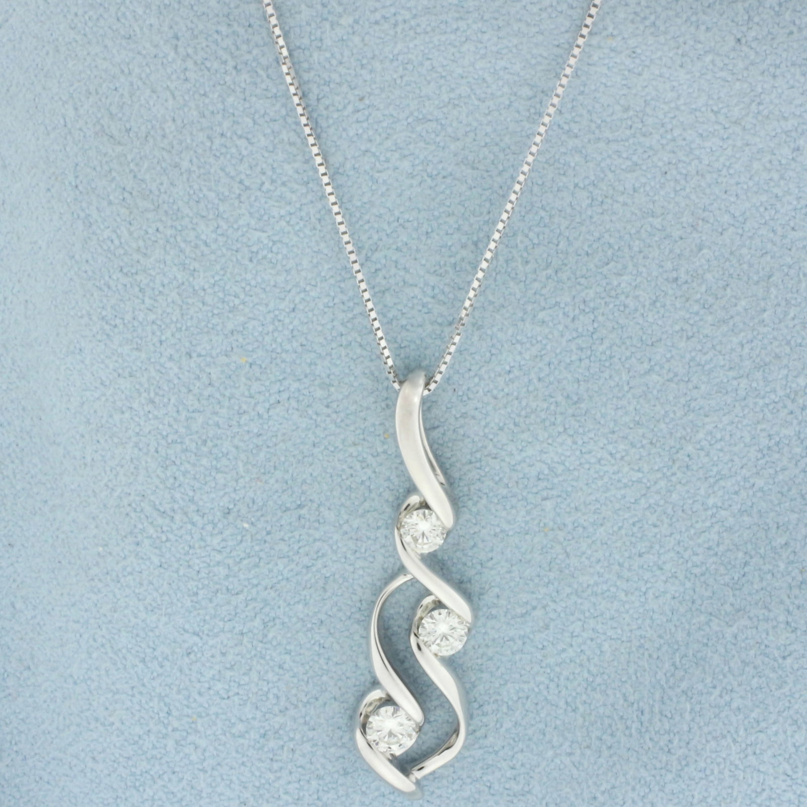 Designer Sirena Diamond Pendant on Box Link Chain Necklace in 14k White Gold: In 14k white gold. By designer Sirena. Contains 3 round brilliant cut diamonds, 1/3ct TW, SI clarity/I color. Box link chain measures 18 inches long, 1mm wide. Pendant Measures 29m long by 7mm wide. S