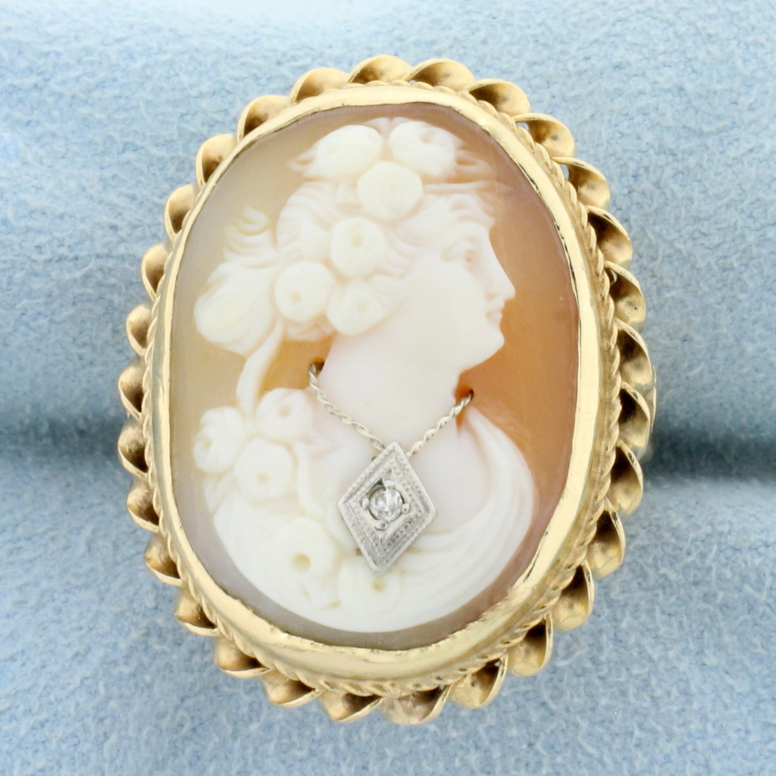 Diamond Cameo Ring in 14K Yellow Gold: In 14K Yellow Gold. Contains one high quality .01ct Diamond. Cameo measures 23 x 17mm. Size 5. 11.3g.