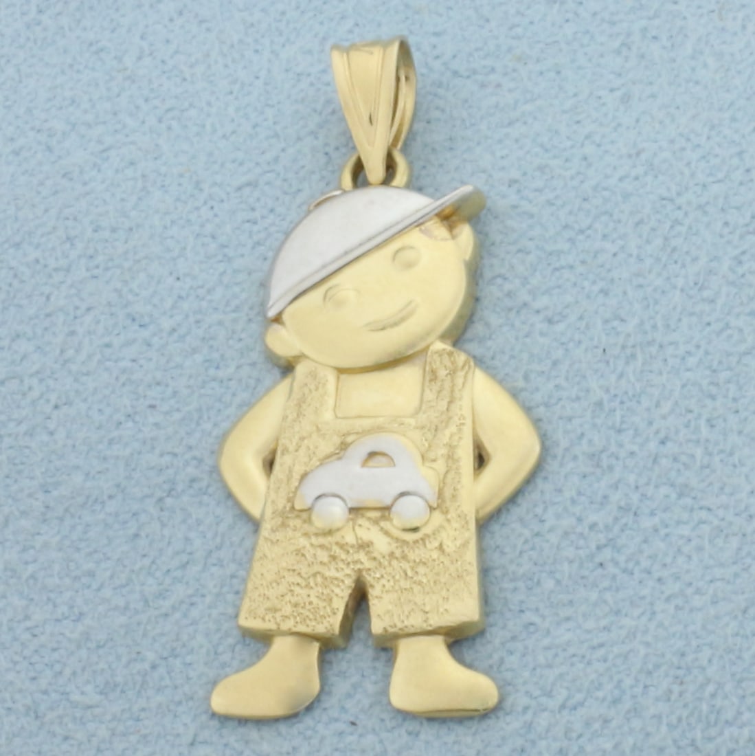 Little Boy Pendant in 14k Yellow and White Gold: In 14k Yellow and White Gold. 1 1/4 inch long including bale. 1/2 inch wide at widest. 1.6g.