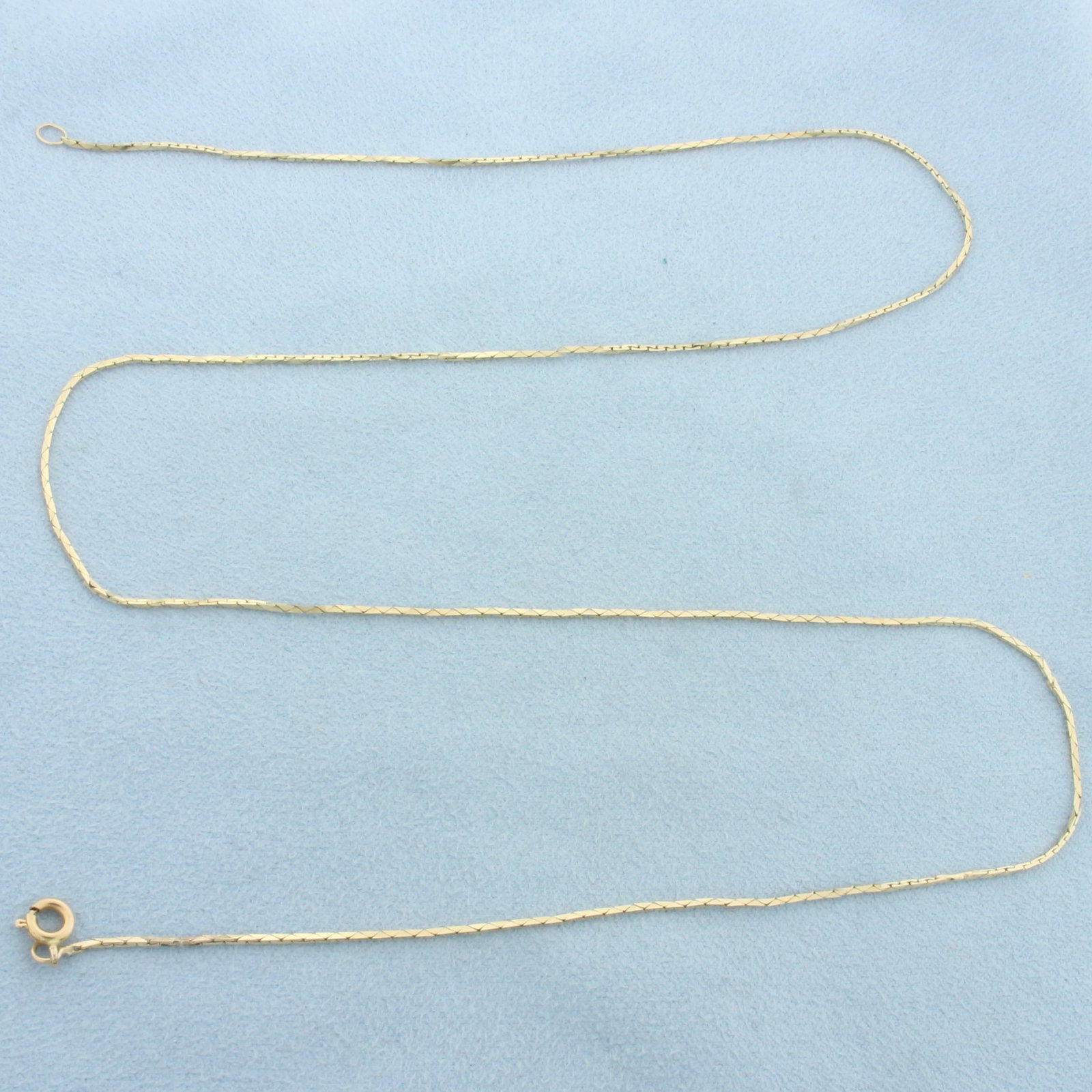 22 Inch Boston Link Chain Necklace in 14k Yellow Gold: In 14k Yellow Gold. 22 inches long. 0.8mm wide. Spring clasp. 3.2g.