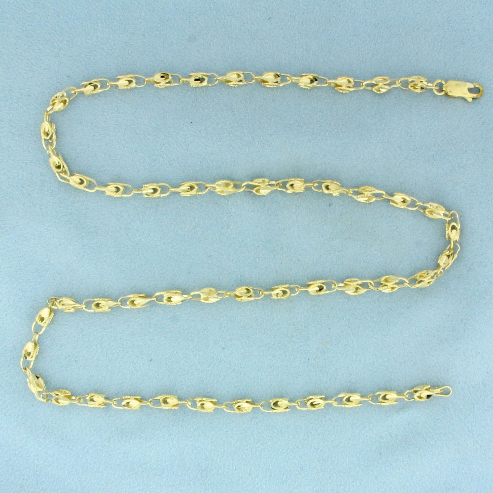 20 Inch Diamond Cut Fancy Open Box Link Chain Necklace in 10k Yellow Gold: In 10k Yellow Gold. 20 inches long. 4mm wide. Diamond cut details for added brilliance. Lobster clasp. 11.8g.
