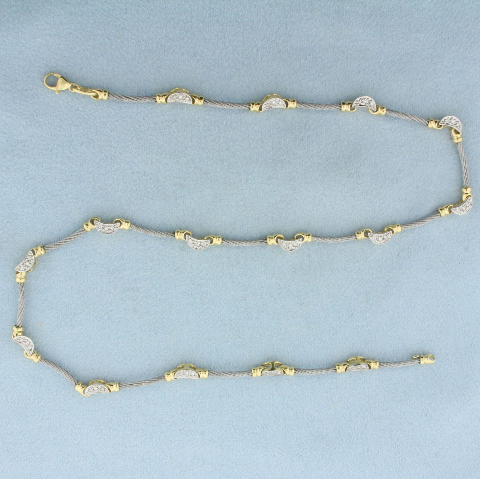 Charriol Phillip Designer Diamond Cable Link Necklace in 18k Yellow Gold and Steel: In 18k Yellow Gold and Steel. Contains forty-five high quality 1/2pt diamonds. 16 inches long. Lobster clasp. 15.6g.