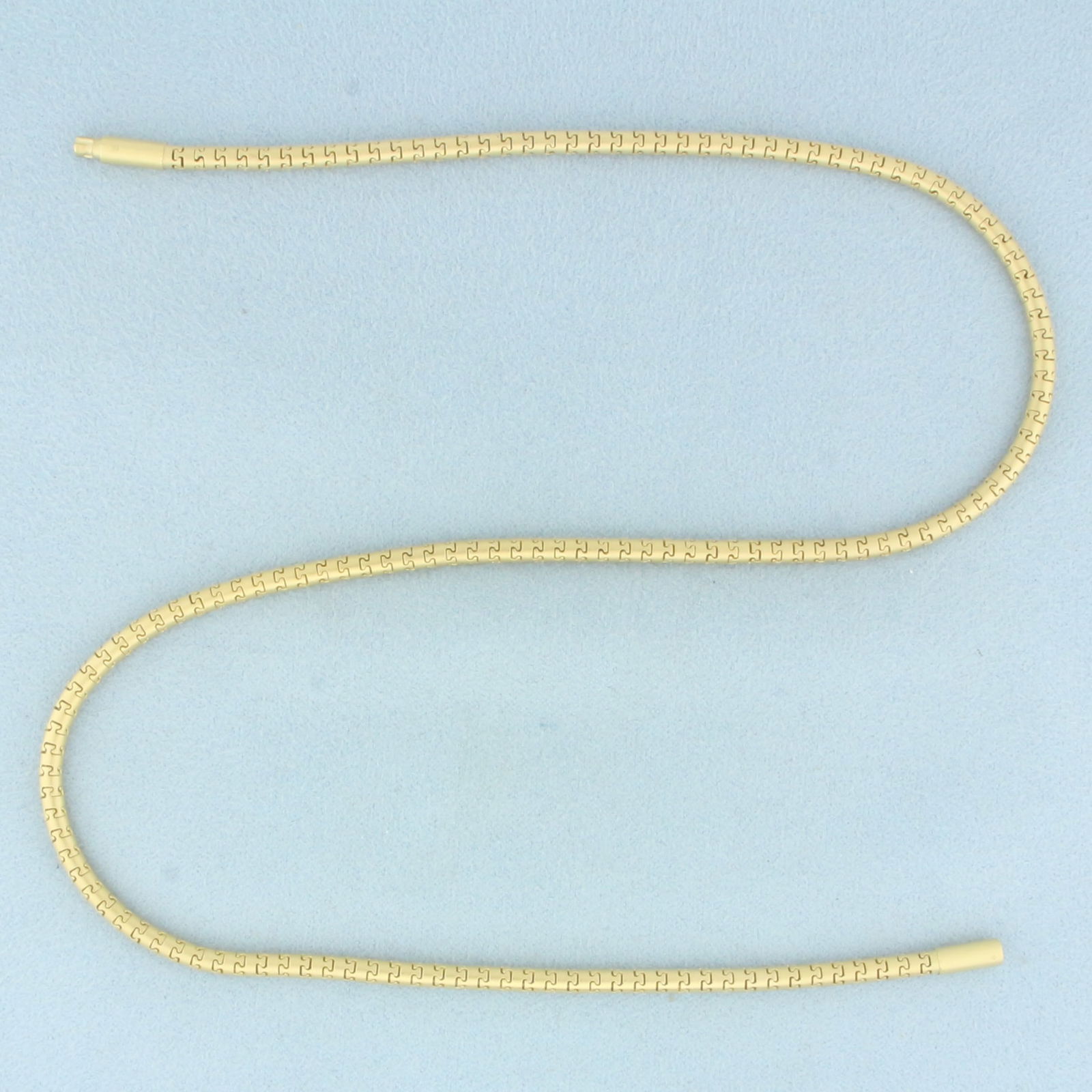 16 Inch Satin Finish Choker Snake Link Chain Necklace in 18k Yellow Gold: In 18k Yellow Gold. 16 inches long. 3mm wide. Unique satin finish. Twist lock closure. 21.1g.