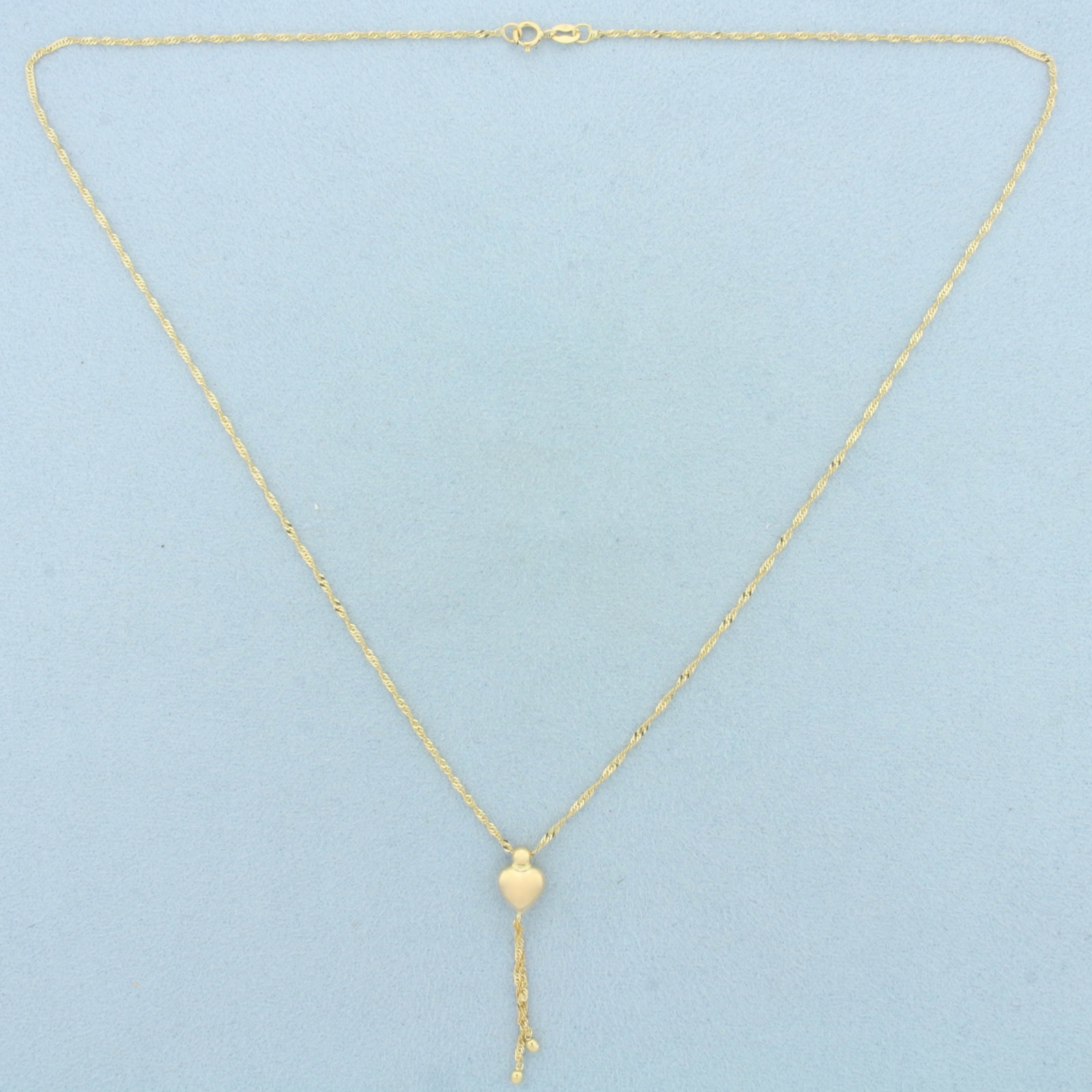 Italian 18 Inch Twisting Curb Link Heart Chain Necklace in 14k Yellow Gold: In 14k Yellow Gold. 18 inches long. 1.2mm thick chain. Made in Italy. Spring clasp. 1.7g.