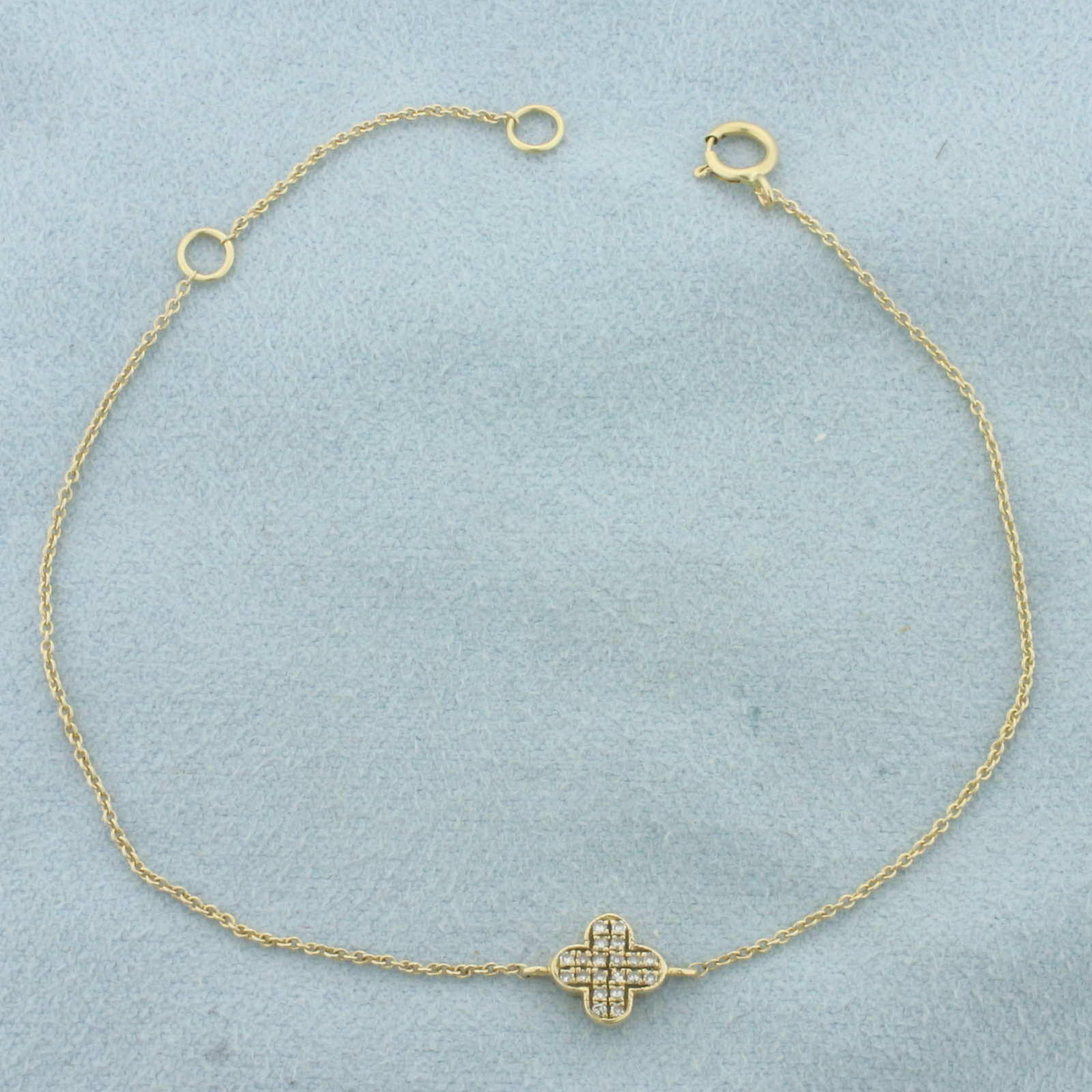 Diamond Pave Clover Bracelet in 14k Yellow Gold: In 14k Yellow Gold. Contains twenty high quality 1/2pt diamonds. Adjustable length - 7 1/8 or 6 1/4 inches long. 1/4 inch wide (at center). Spring clasp. 1.0g.