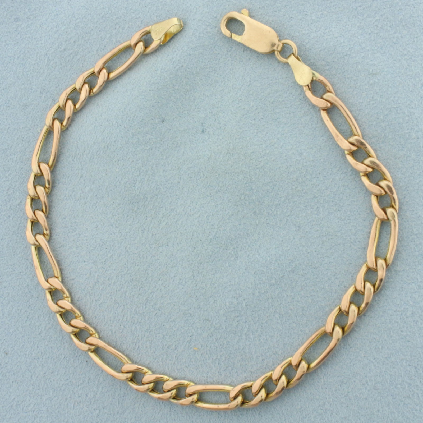 Figaro Link Bracelet in 10k Rose Gold: In 10k Rose Gold. 8 1/2 inches long. 5mm wide. Lobster clasp. 6.1g.
