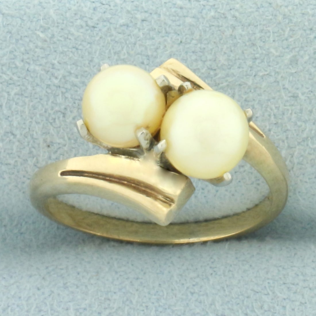 Cultured Akoya Pearl Toi Et Moi Bypass Ring in 14k Yellow Gold: In 14k yellow gold. Contains one 6.1mm and one 6.5mm high quality cultured Akoya pearls with strong luster and creamy golden color. Size: 7. 4.6g.