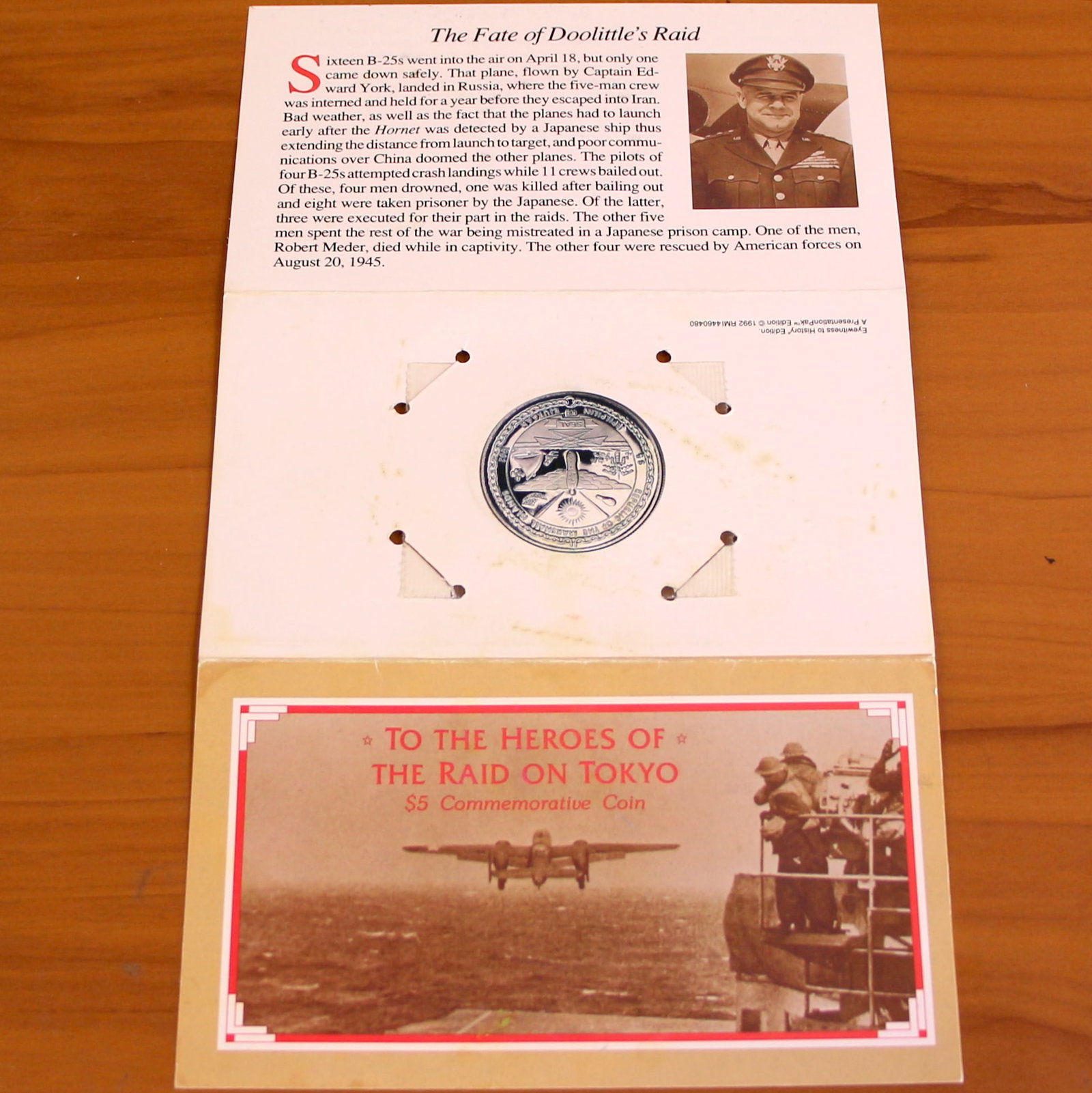 To The Heroes of The Raid on Tokyo $5 Commemorative Coin: Contains one 1992 The Heroes of The Raid on Tokyo $5 Commemorative Coin issued by the Republic of the Marshall Islands. Includes original booklet and casing.