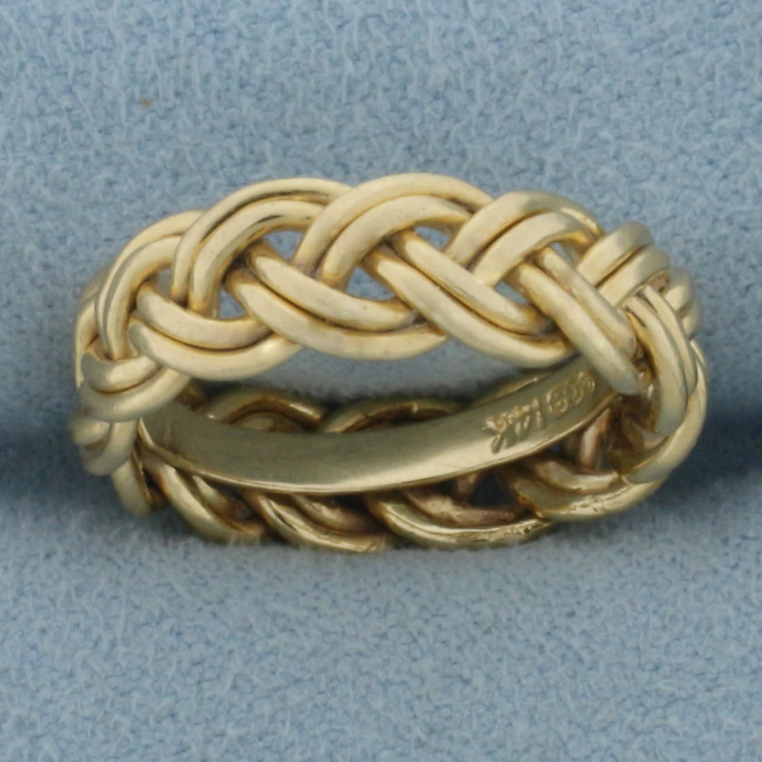 Braided Band Ring in 14k Yellow Gold: In 14k Yellow Gold. 6mm wide. Size 6.75. 4.6g.