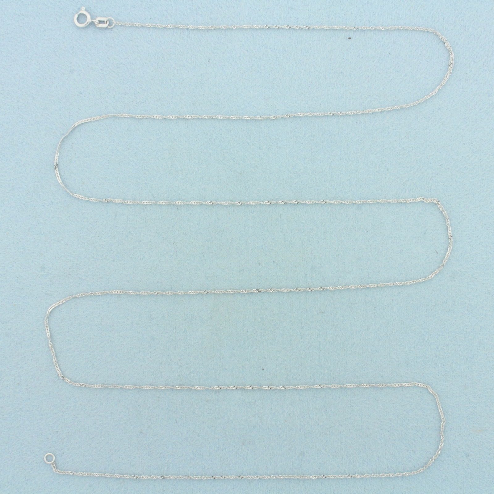 30 Inch Twisting Curb Link Chain Necklace in 18k White Gold: In 18k White Gold. 30 inches long. 1mm wide. Spring clasp. 1.4g.