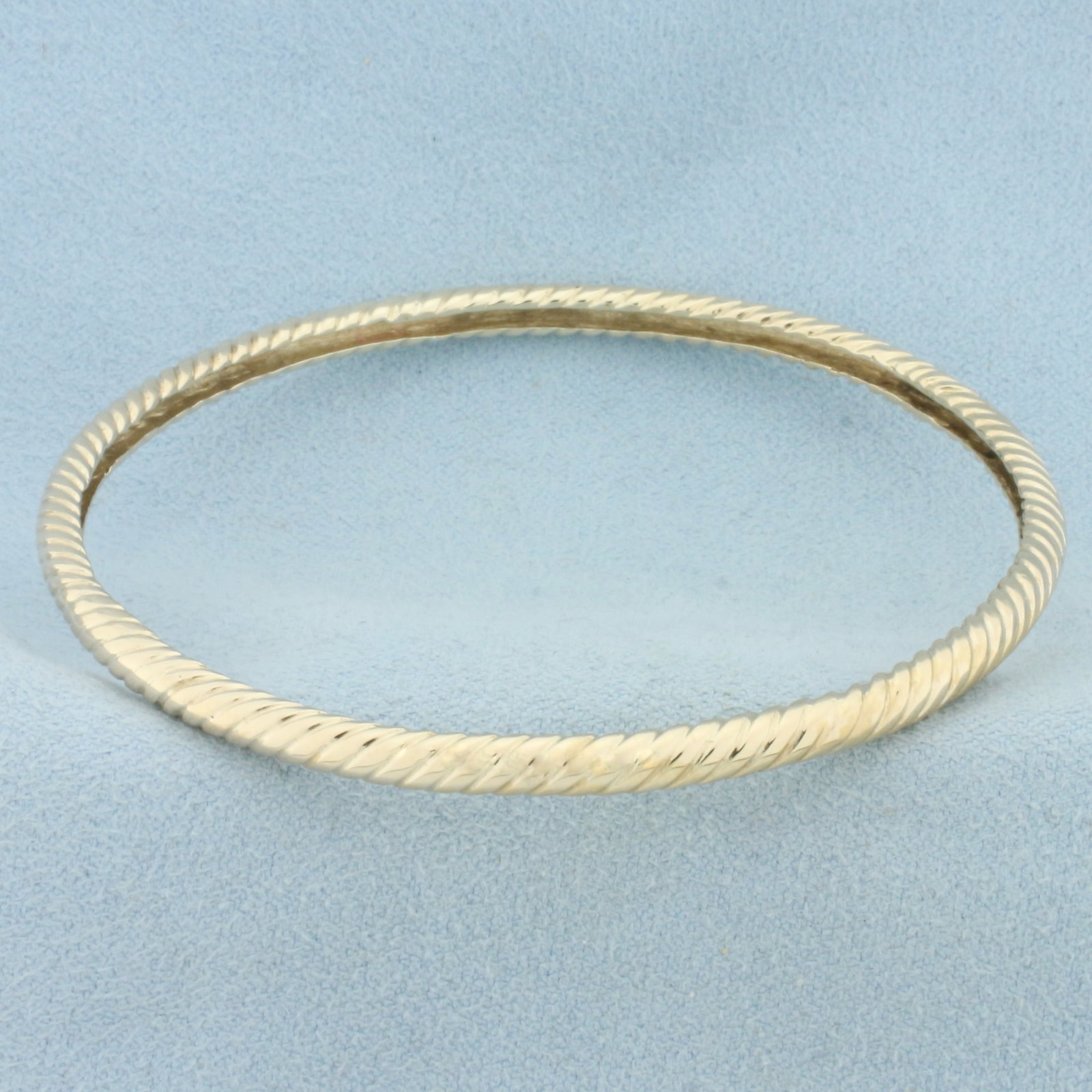 Rope Bangle Bracelet in 14k Yellow Gold: In 14k Yellow Gold. Interior diameter: 2 3/8 inches. 3.6mm wide. 13.g.