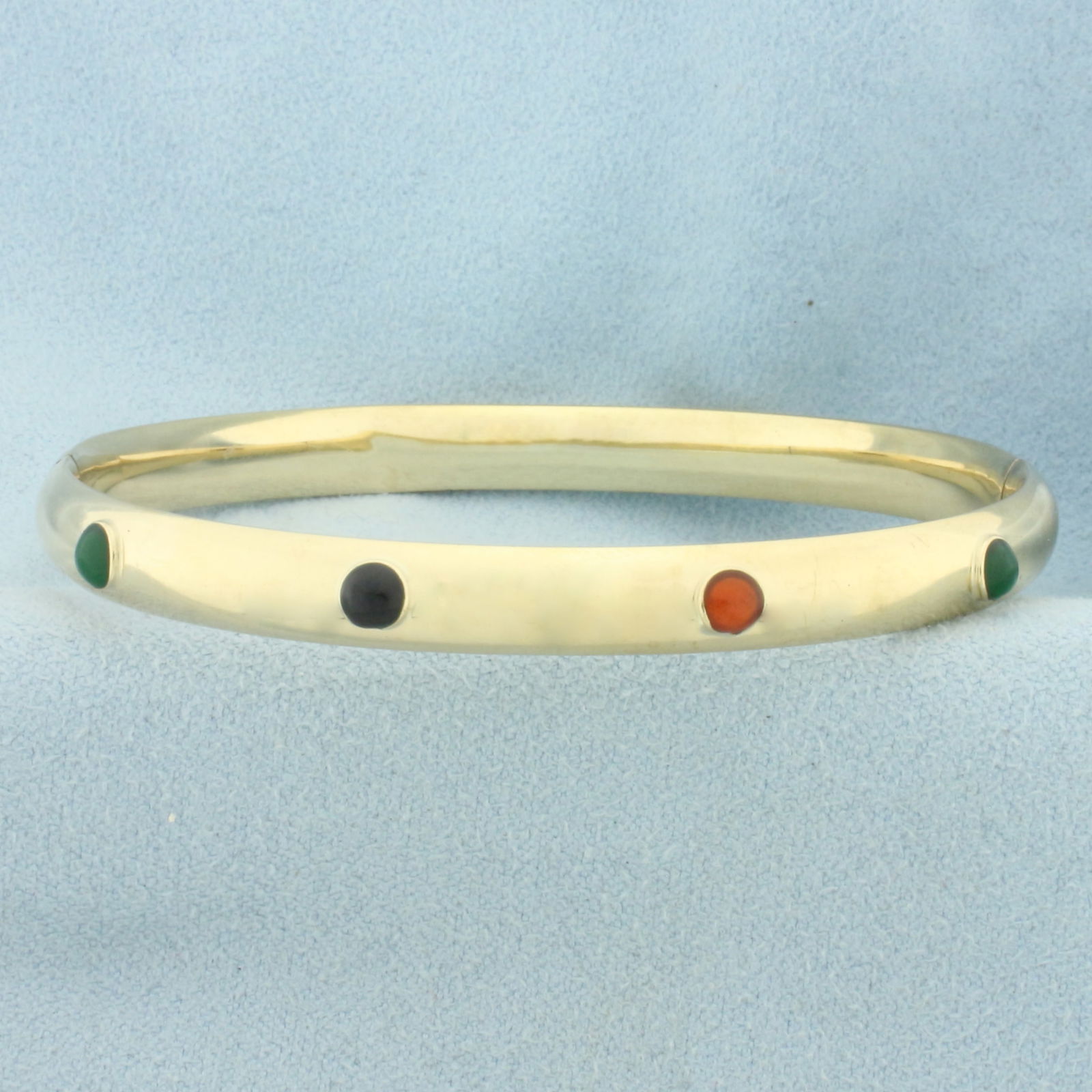 Rainbow Gem Hinged Bangle Bracelet in 14k Yellow Gold: In 14k Yellow Gold. Contains eight 3mm high quality gemstones. Interior dimensions: 2 3/8 by 2 1/4 inch. 6mm wide. Hinged bar slide opening. Minor dents, not noticeable. 8.5g.