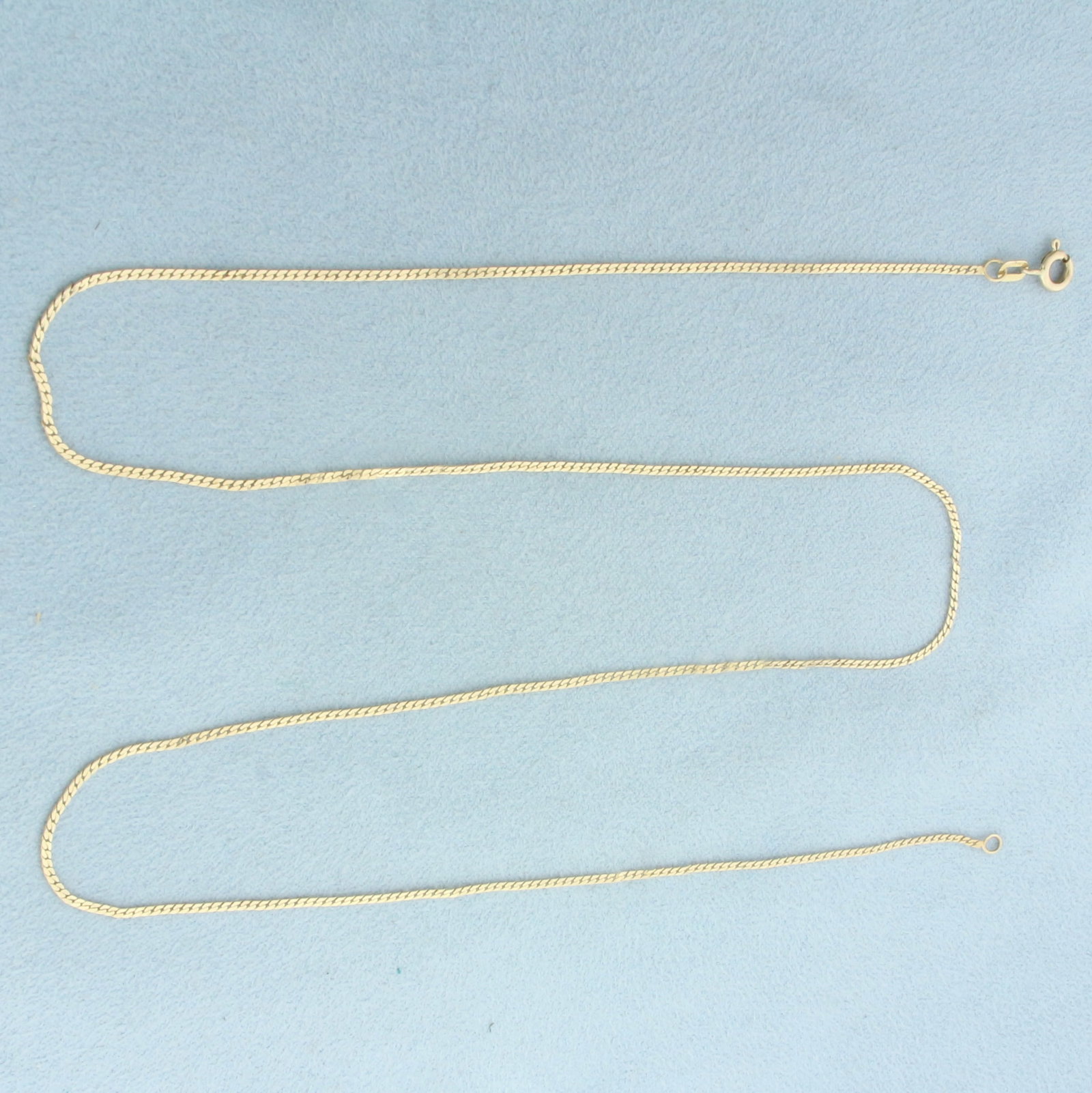 20 Inch Italian Curb Link Chain Necklace in 14k Yellow Gold: In 14k Yellow Gold. 20 inches long. 1mm wide. Spring clasp. 1.8g.