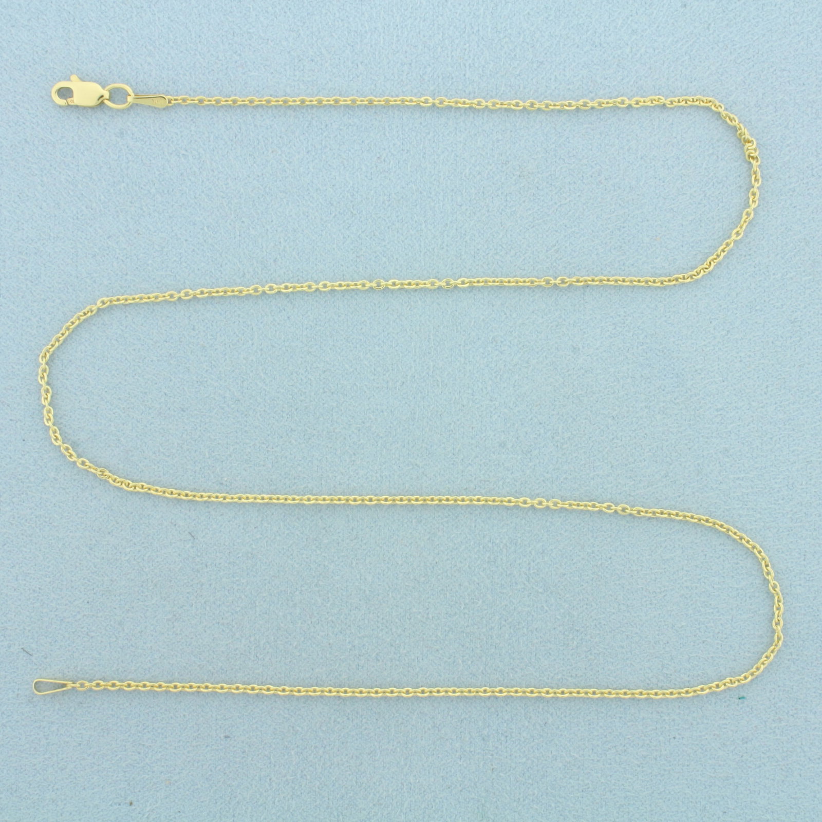 18 Inch Cable Link Chain Necklace in 14k Yellow Gold: In 14k Yellow Gold. 18 inches long. 1.3mm wide. Lobster clasp. 1.5g.