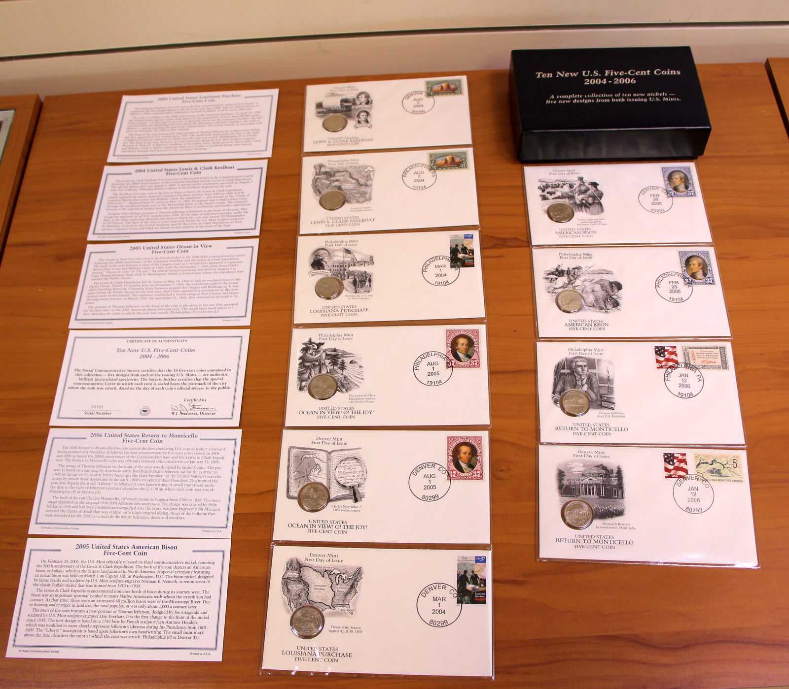 US Mint Ten New US Five Cent Nickel Coin Collection OGP: Contains ten 2004-2006 new designed nickel coin collection. Set in mint envelopes and plastic covering with box and contains certificate of authenticity.