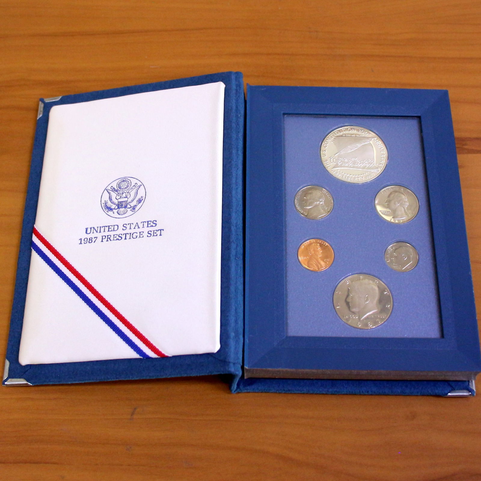 1987S US Mint Prestige Proof Silver Coin Set With Box: Contains one 1987 United States Mint Prestige Set including 90% silver dollar. Set in original government packaging/book.