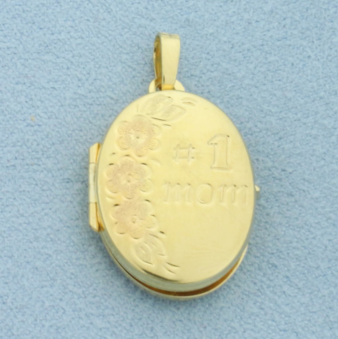 Locket #1 Mom Pendant in 14k Yellow Gold: In 14k Yellow Gold. 1 inch long (including bale). 1/2 inch wide. Opens to 1 1/8 inch wide. 2.0g.