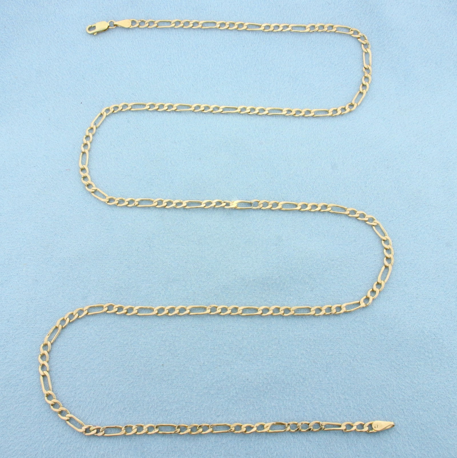 24 Inch Italian Figaro Chain Link Necklace in 10k Yellow Gold: In 10k Yellow Gold. 24 inches long. 13.1mm wide. Made in Italy. Lobster clasp. 2.9g.