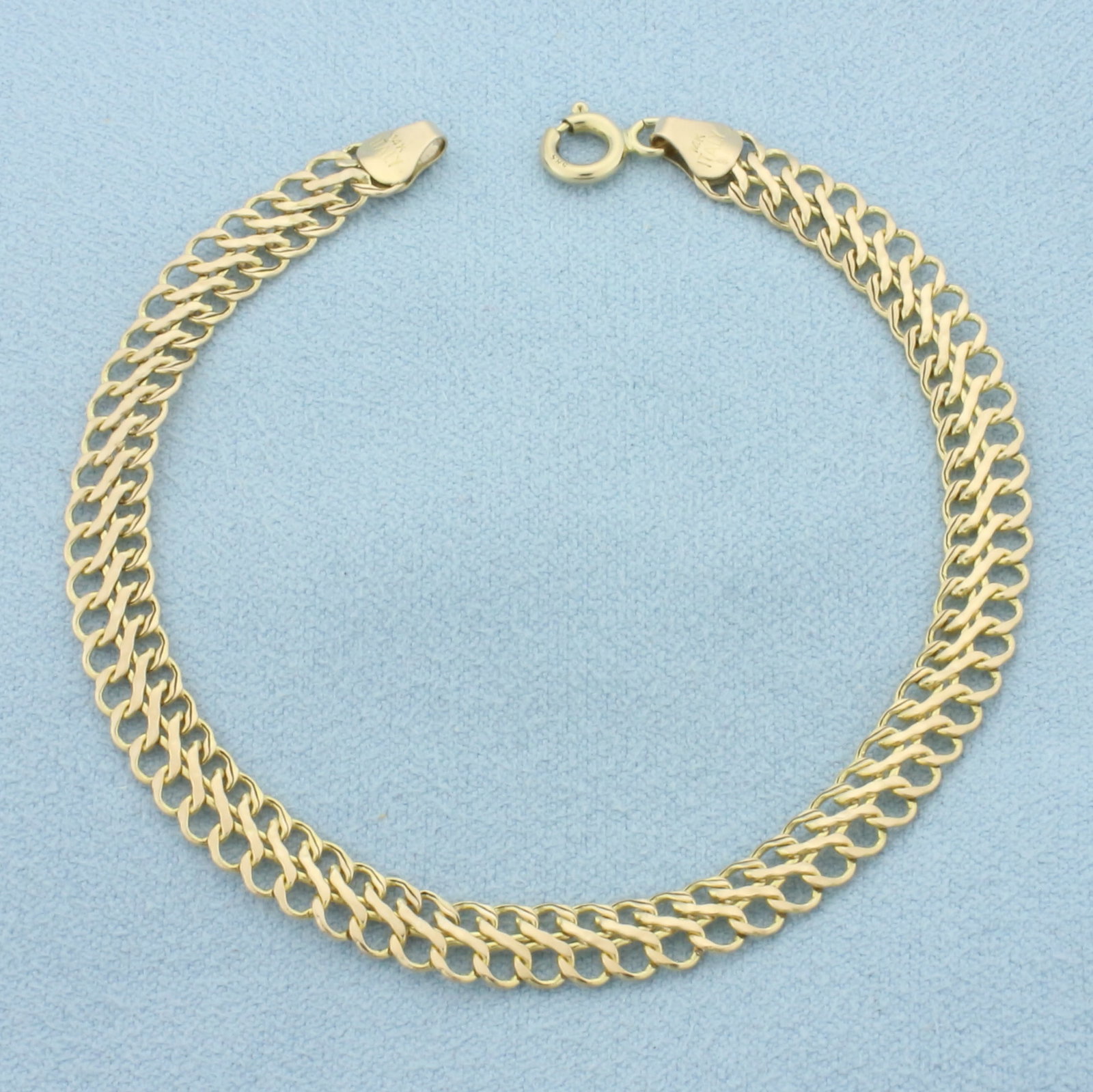 Double Curb Link Bracelet in 14k Yellow Gold: In 14k Yellow Gold. 7 inches long. 5.7mm wide. Spring clasp. 2.3g.