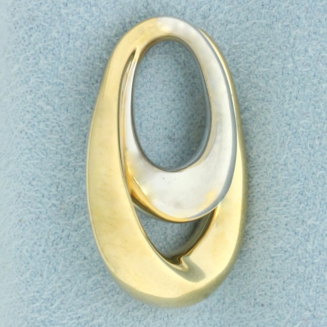 Two Tone Double Oval Modern Design Pendant or Slide in 14k Yellow and White Gold: In 14k Yellow and White Gold. 1 inch long. 5/8 inch wide. 1.6g.