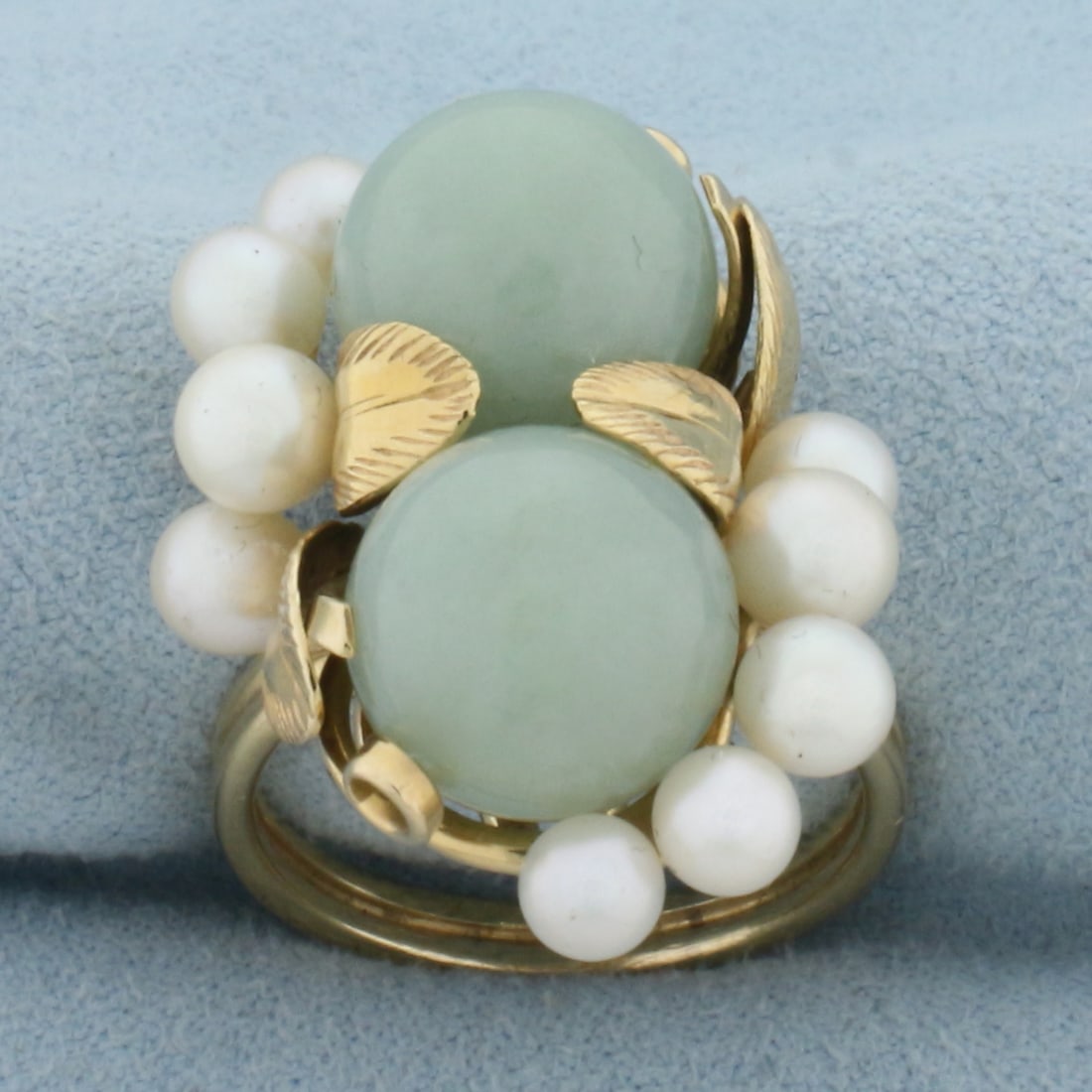 Designer Ming's Hawaii Jade and Pearl Leaf Design Ring in 14K Yellow Gold: In 14K Yellow Gold. Contains two high quality natural 11mm Jade gemstones with beautiful green color and excellent clarity. Also contains ten 4.5mm Cultured Pearls with high luster. Size 8. 11.7g
