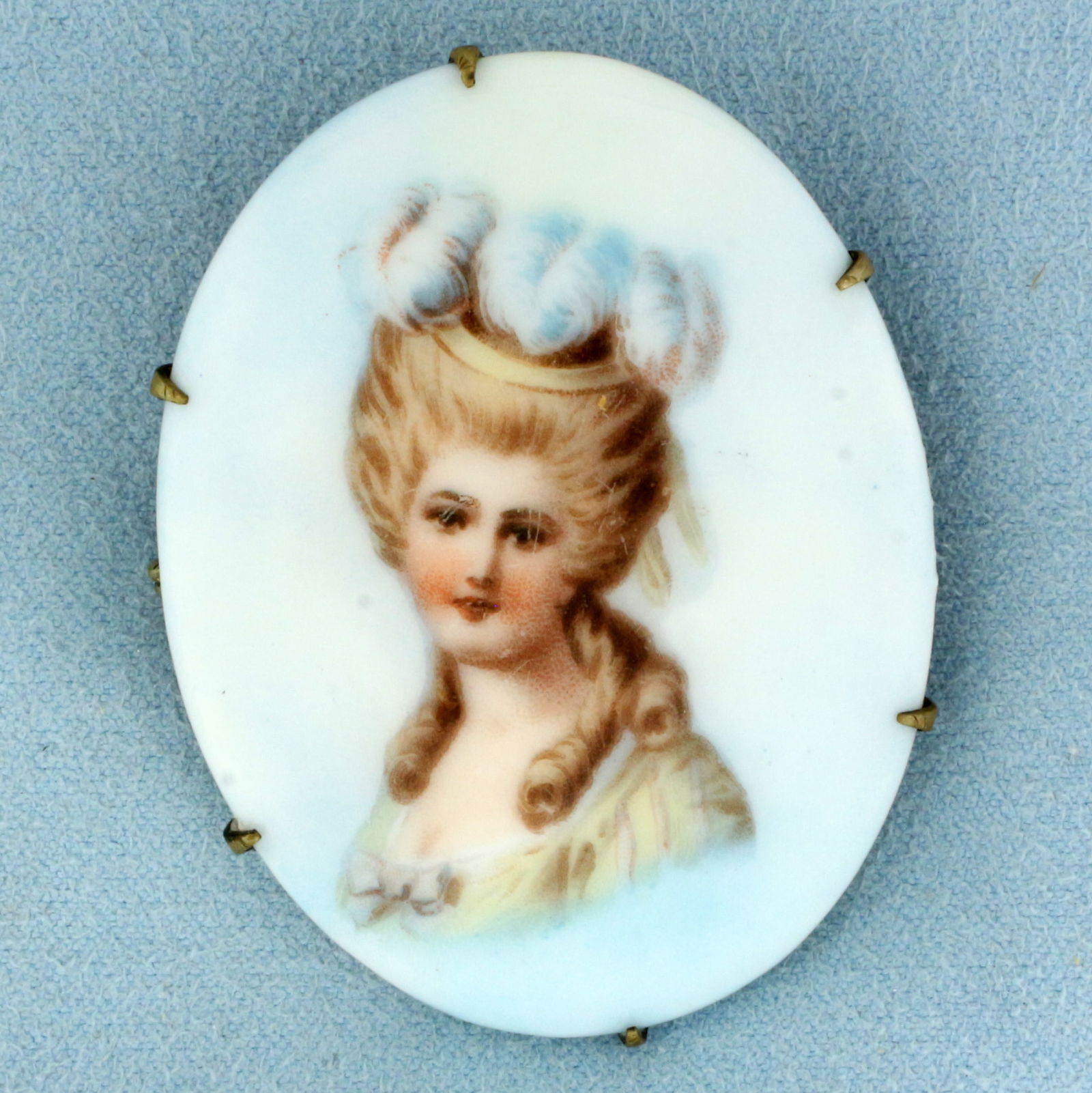 Victorian Hand Painted Porcelain Cameo Brooch Pin: Brass back, porcelain cameo. 2 inches long x 1.5 inches wide. 22.4g.