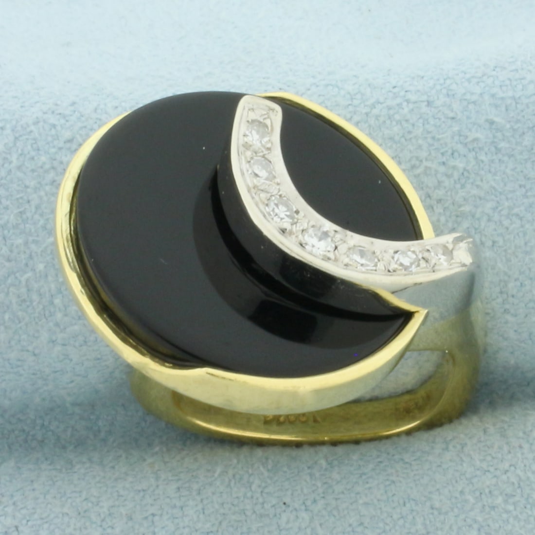 Designer Modern Onyx and Diamond Euro Shank Ring in 18k Yellow and White Gold: In 18k Yellow and White Gold. Contains one 20mm circular Onyx plaque. Also contains seven high quality diamonds, 1/4ct TW, VS clarity/G color. 21mm wide at top. Euro shank. Size 5.5. 15.2g.
