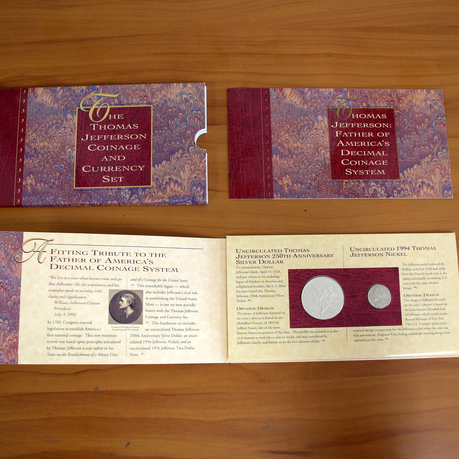 US Mint Thomas Jefferson Coinage and Currency Coin Set OGP: Contains one 1993 Uncirculated Thomas Jefferson 250th Anniversary Silver Dollar. Also contains one 1994 Uncirculated Thomas Jefferson Nickel. There is also a 1976 Uncirculated Jefferson Two Dollar Gre