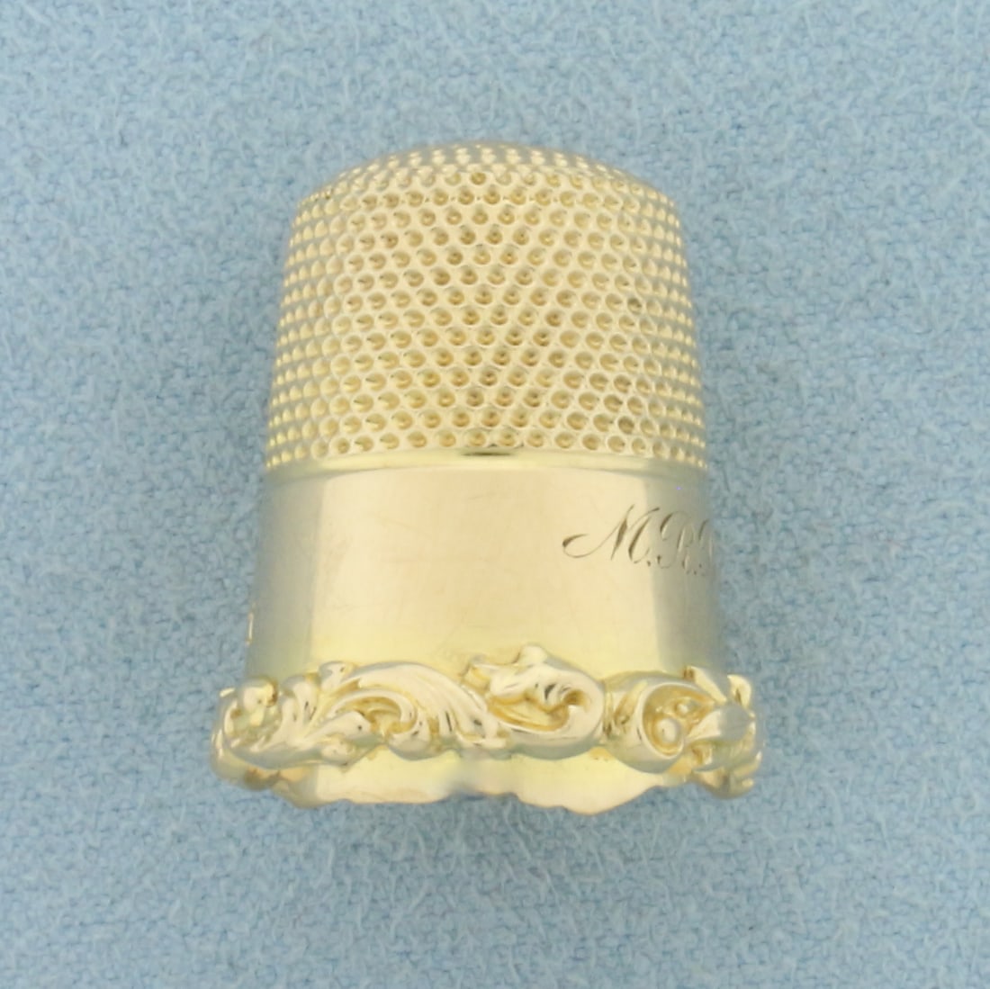 Antique 1911 Thimble in 14k Yellow Gold: In 14k Yellow Gold. Size 11 thimble. Antique hand engraved "M.R. Bancraft 1911". 5.3g.