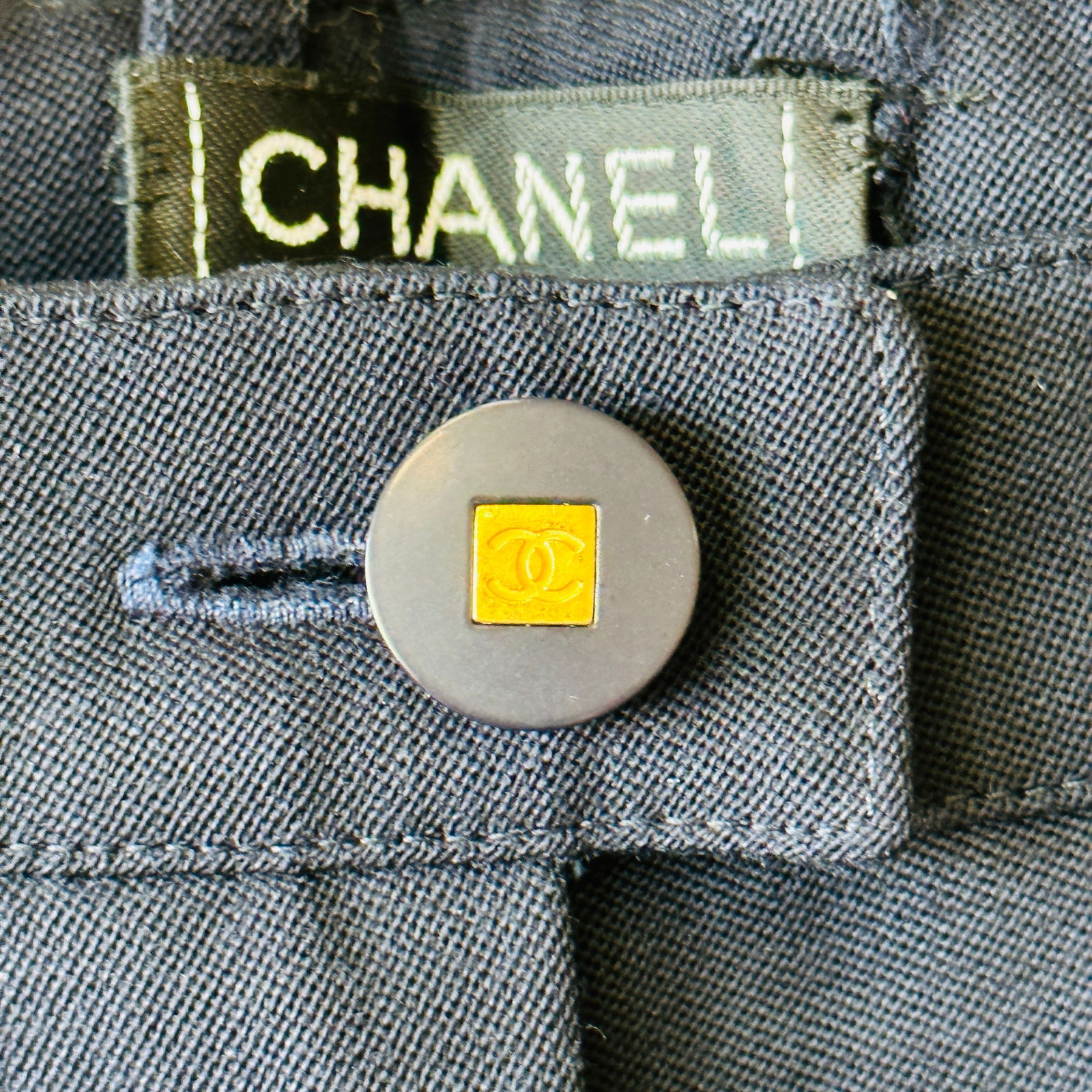 Chanel CC Logo Button Pockets Navy Wide Cuff Wool Pants 38: 100% wool, 100% silk lining. 96A, P08799V04526, AA941, size 38. Iconic CC logo gold accented buttons. Two back pockets, subtle wide leg style with triple stitched wide cuff. Excellent vintage conditio