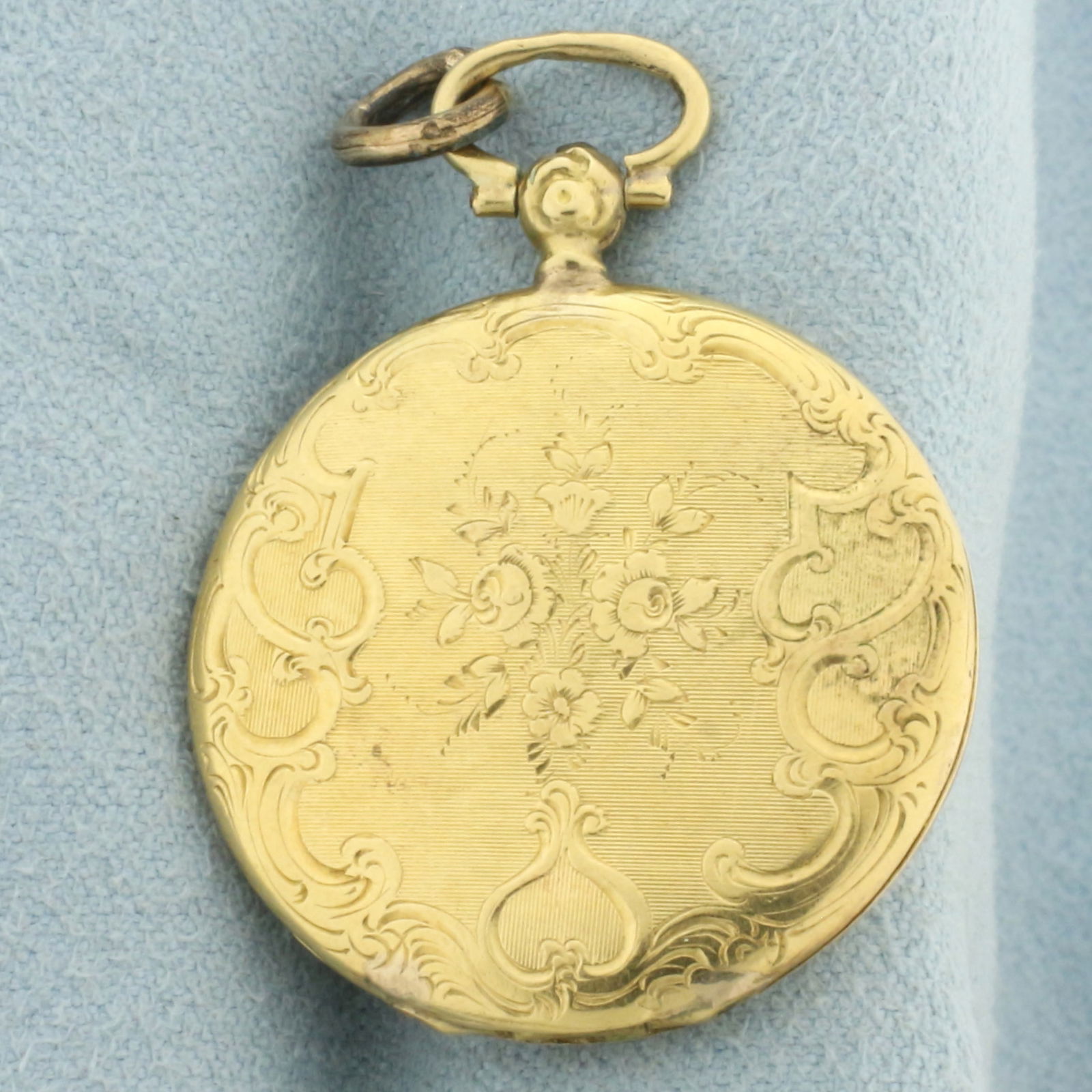 Antique Victorian Remembrance Locket with Hair Art in 18k Yellow Gold: In 18k yellow gold. 1 1/2 inches long. Art created from hair of loved one still preserved. Can be removed. 7.4g.