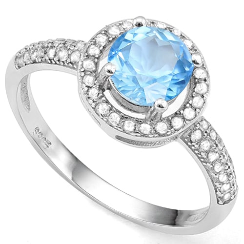 Sky Blue Topaz and White Sapphire Halo Ring in Sterling Silver: In platinum over .925 sterling silver. Contains one sky blue topaz gemstone, .85cts, with excellent color and clarity. Accented with .28ctw white sapphires. Size 8. 1.8g