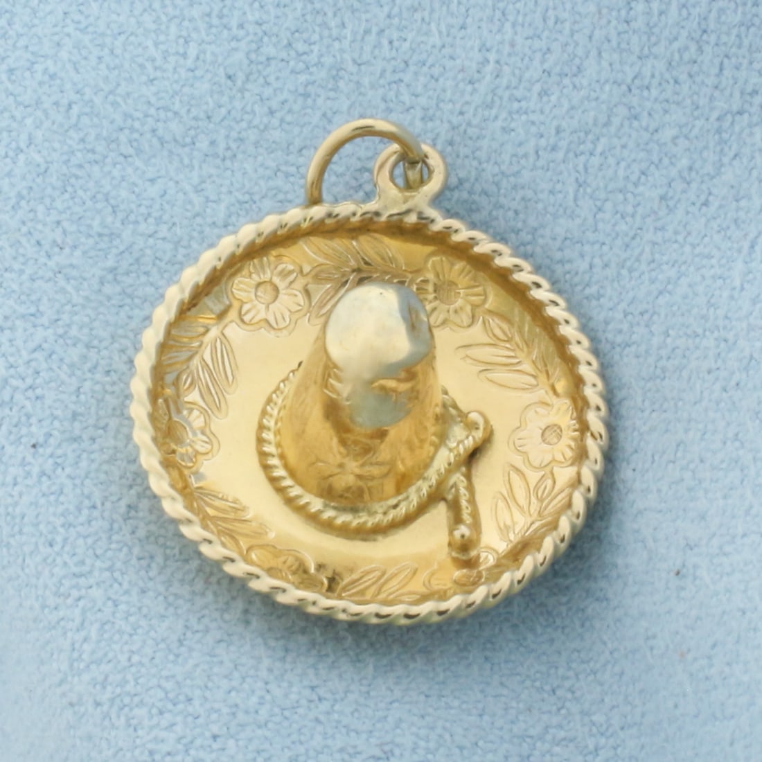 Sombrero Charm in 14k Yellow Gold: In 14k Yellow Gold. 3/4 inch long. 3/4 inch wide. 2.2g.