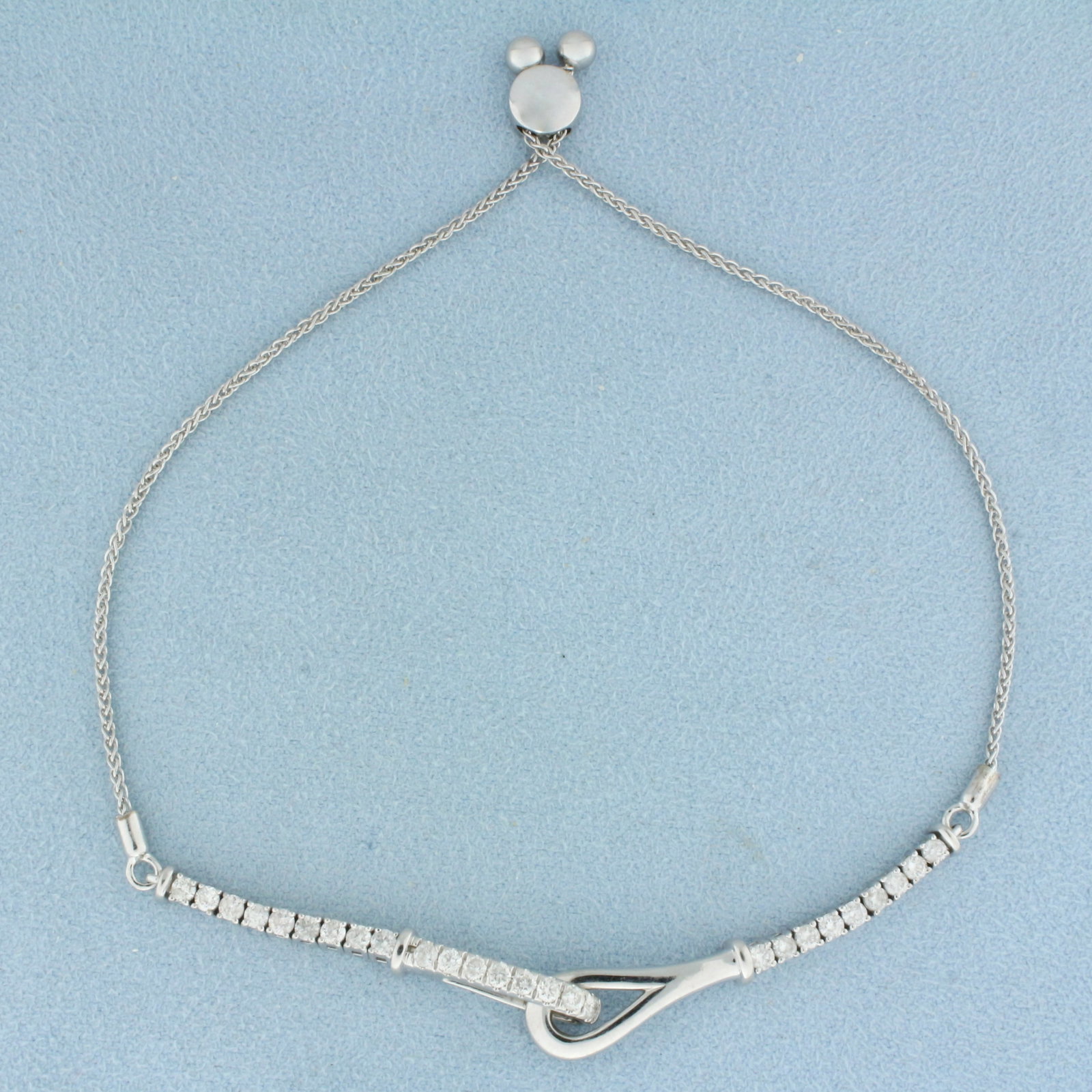 Adjustible Length Designer Diamond Bracelet In 14k White Gold: In 14k white gold. Contains twenty six .05ct high quality diamonds, SI clarity/G color. Bracelet can be adjusted to any length. 7.8g.