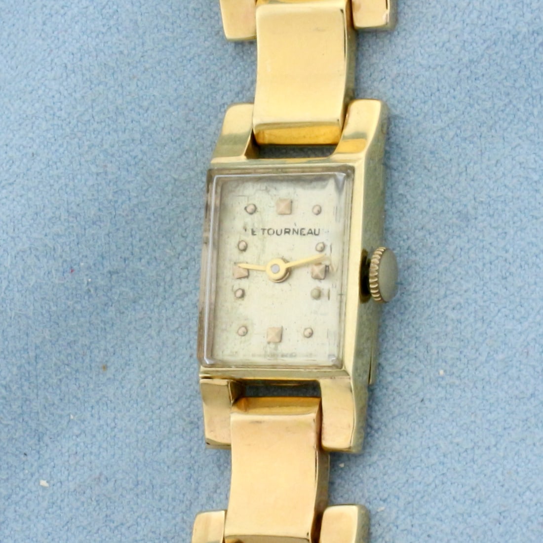 Womens Vintage Tourneau Wrist Watch in Solid 14K Yellow Gold: Band and Case In Solid 14K Yellow Gold. Swiss made quartz movement runs great, new battery. 7 1/8 inches long, Case 18mmx14mm. Great overall condition for age. 26.7g.