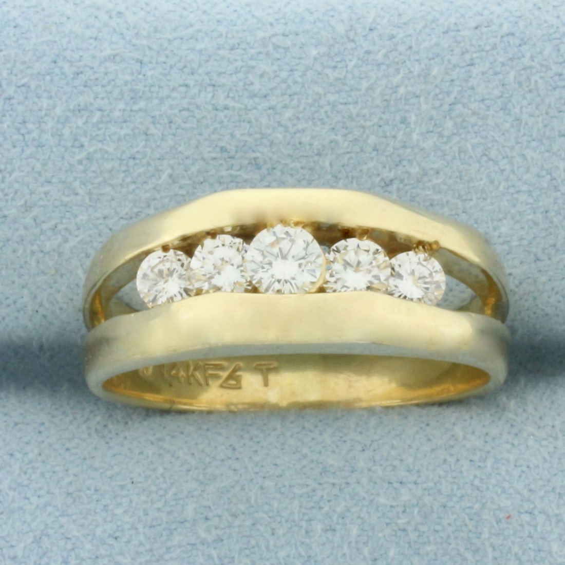 Mens Five Stone Diamond Ring in 14k Yellow Gold: In 14k Yellow Gold. Contains one high quality 1/4ct and four 1/8ct high quality round brilliant diamonds, SI clarity/I color, eye clean, great cut for added brilliance. 8mm wide at top. Size 10. 7.4g.