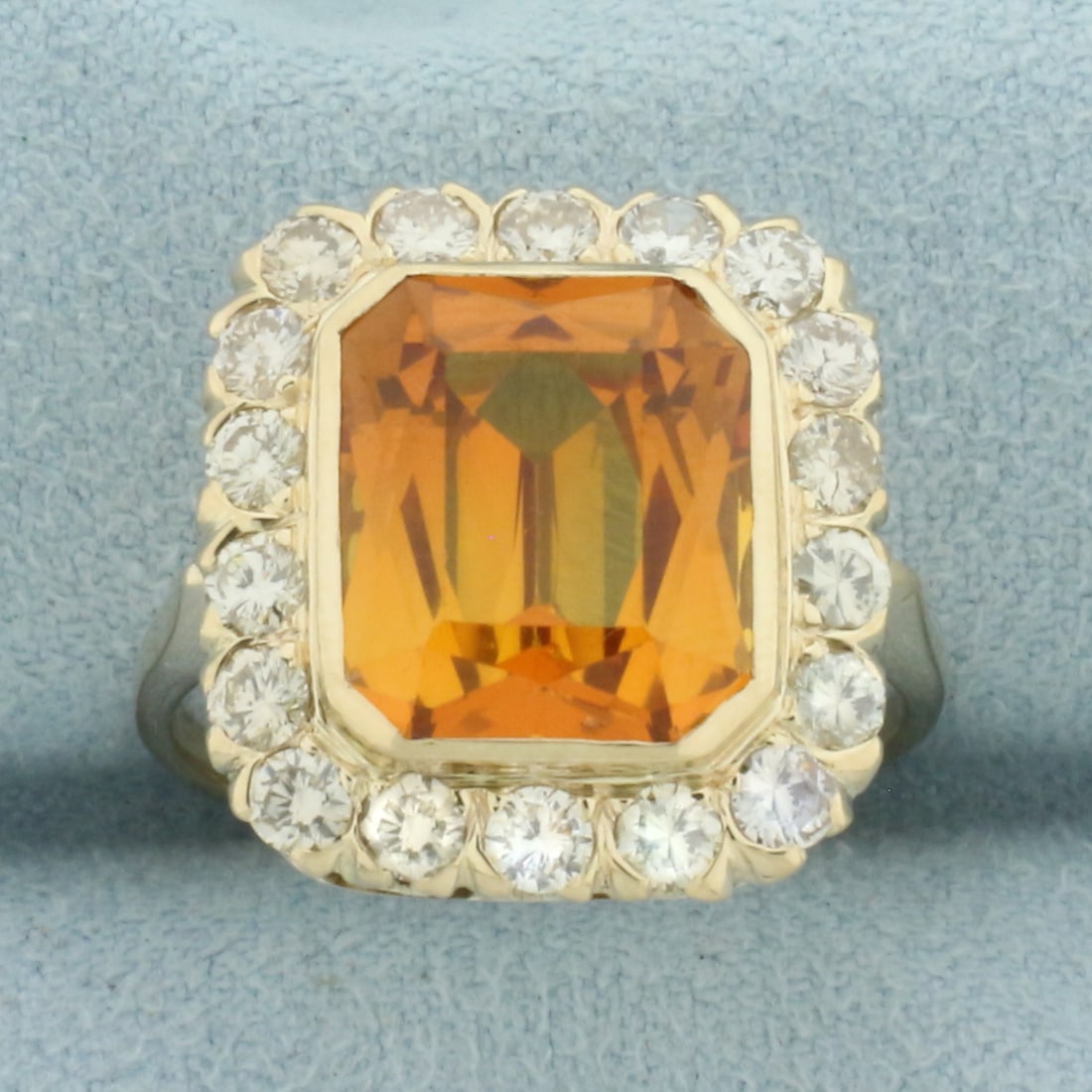 Palmeira Citrine and Diamond Halo Ring in 14k Yellow Gold: In 14k Yellow Gold. Contains one 12x10mm high quality Palmeira Citrine gemstone, with vibrant amber color and excellent clarity. Also contains eighteen high quality diamonds, 3/4ct TW, SI clarity/H co