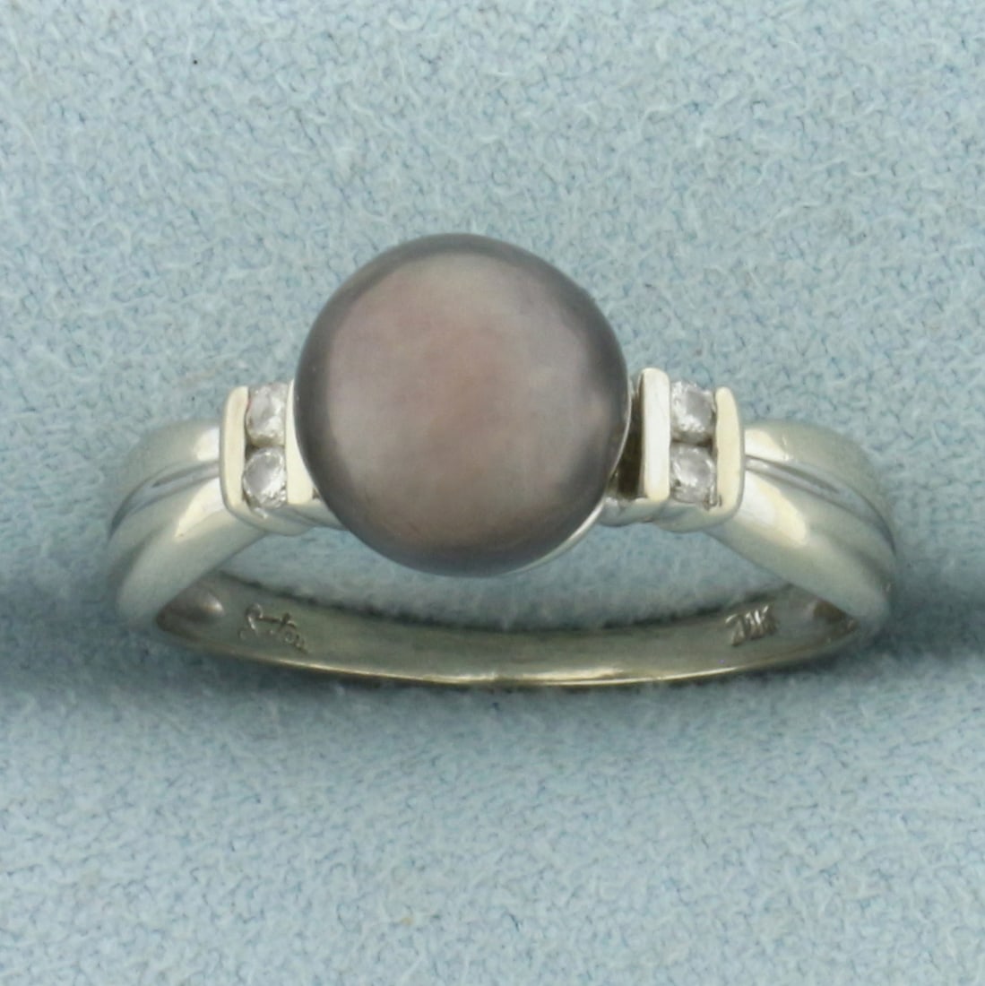 8MM Tahitian Pearl and Diamond Ring in 14k White Gold: In 14k white gold. Contains one high quality black Tahitian pearl, 8.4mm, with beautiful color and luster. Also contains four high quality 1/2pt diamonds. Size: 7.25. 3.4g.