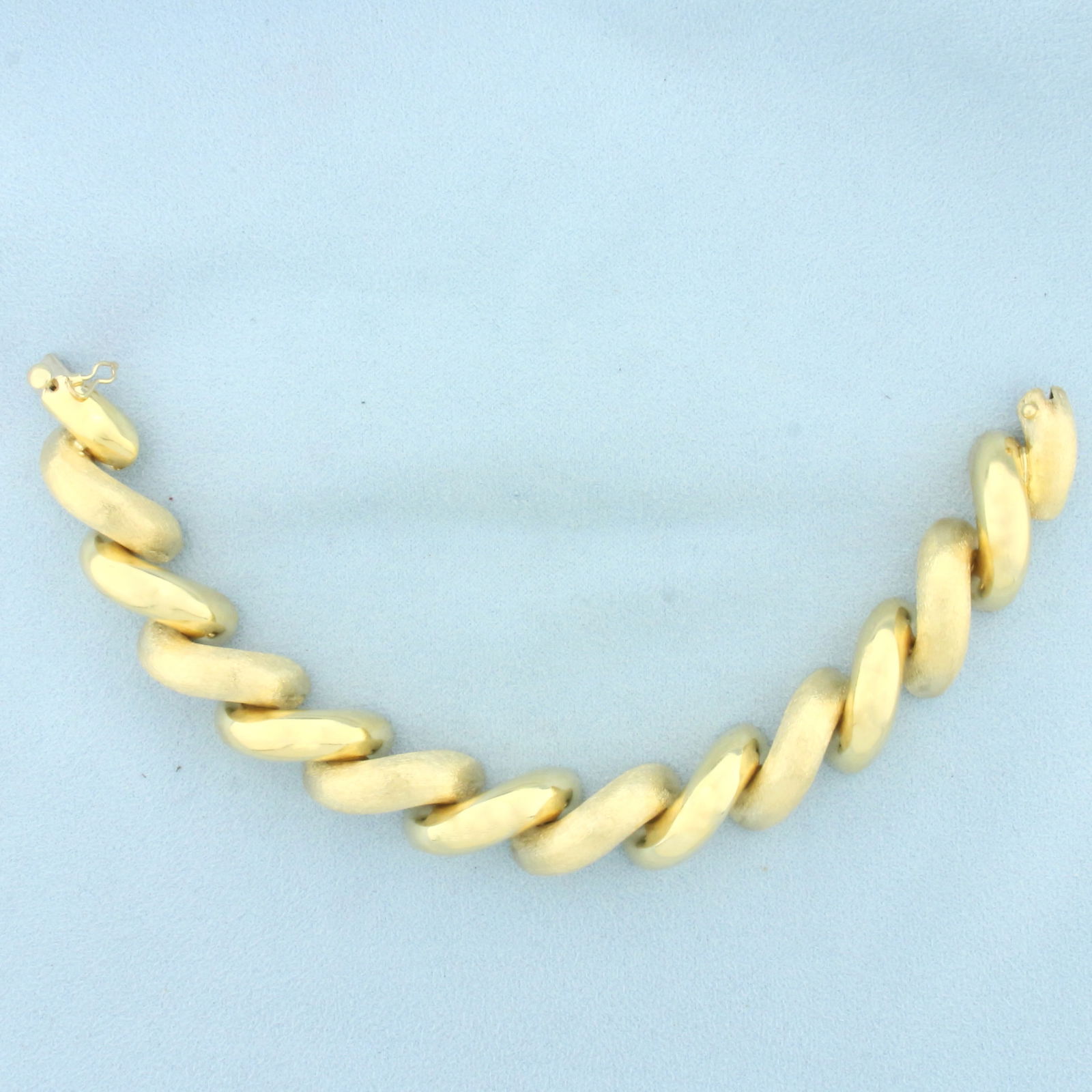 Large Italian San Marco Macaroni Link Bracelet in 14k Yellow Gold: In 14k yellow gold. Italian made. 7 3/4 inches long and 5/8 inch wide. Links alternate between high polish and brushed finish for unique look. Concealed clasp with safety latch. 33.0g.