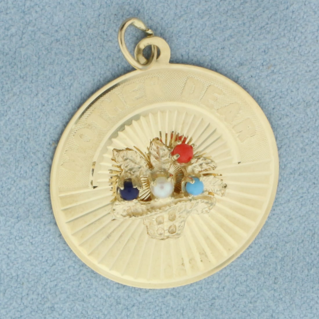 Mother Dear Gemstone Flower Basket Charm in 14k Yellow Gold: In 14k Yellow Gold. Contains 2mm high quality lapis lazuli, carnelian, cultured pearl and Persian turquoise beads. 1 1/4 inches long including jump ring. 1 inch wide. Can engrave name on back. 3.2g.