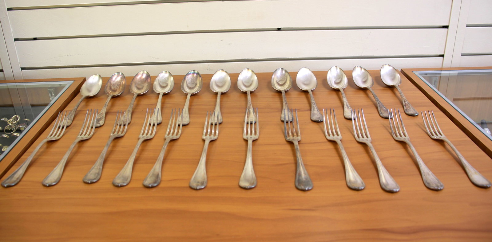 Christofle Rubans Silverplate Flatware Set: Silverplate, old marks early 20th century. Twenty four pieces total. Twelve forks 8.5 inches. Twelve European Place/oval soup spoons 8.5 inches. This is a rare set of larger pieces with a faint hand e